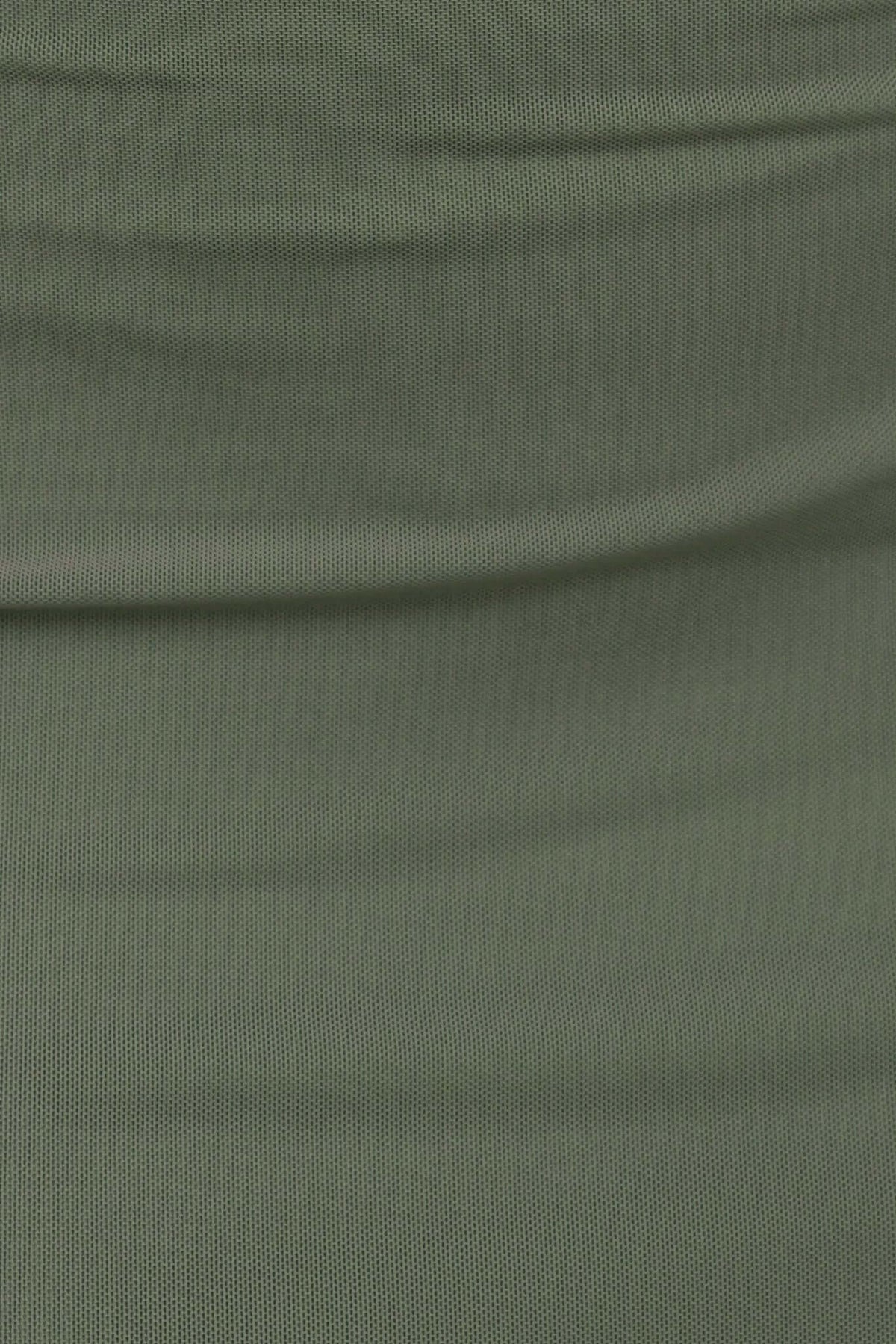 Close-up of soft, stretchy mesh fabric in olive green, ideal for a stylish maxi dress design.