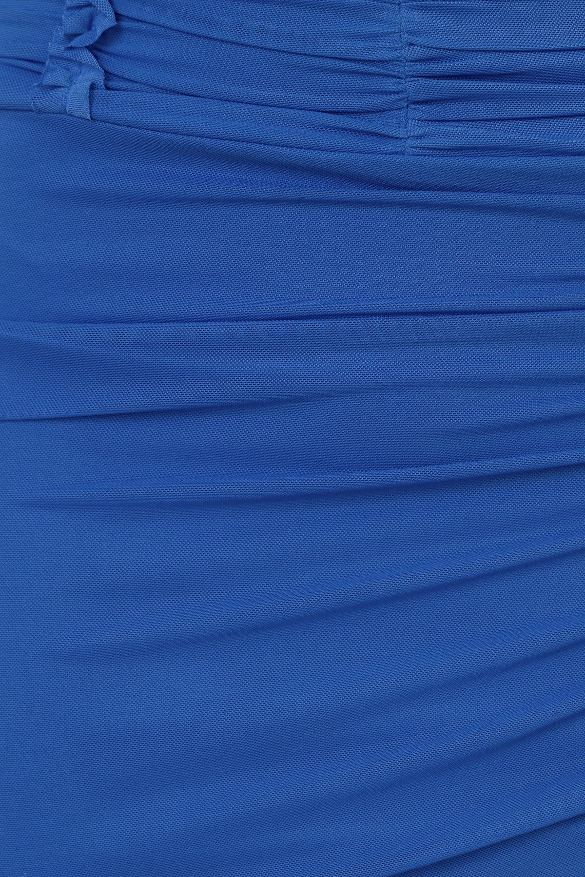 Close-up of blue mesh fabric with gathered detailing, showcasing the texture and stretch of the Deia Top.