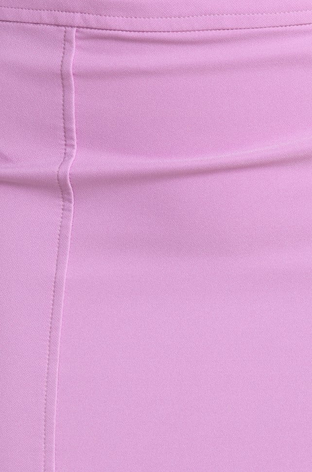 Close-up of a smooth, lilac fabric, showcasing a sleek and stylish design ideal for trendy outfits.