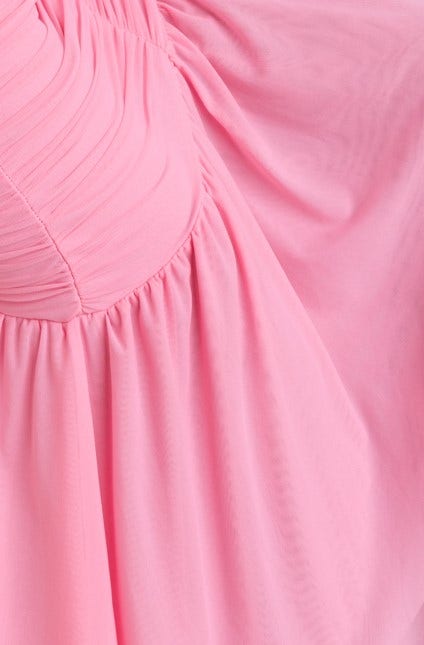 Close-up of Viante Maxi Dress in pink, showcasing ruching detail and soft mesh fabric.