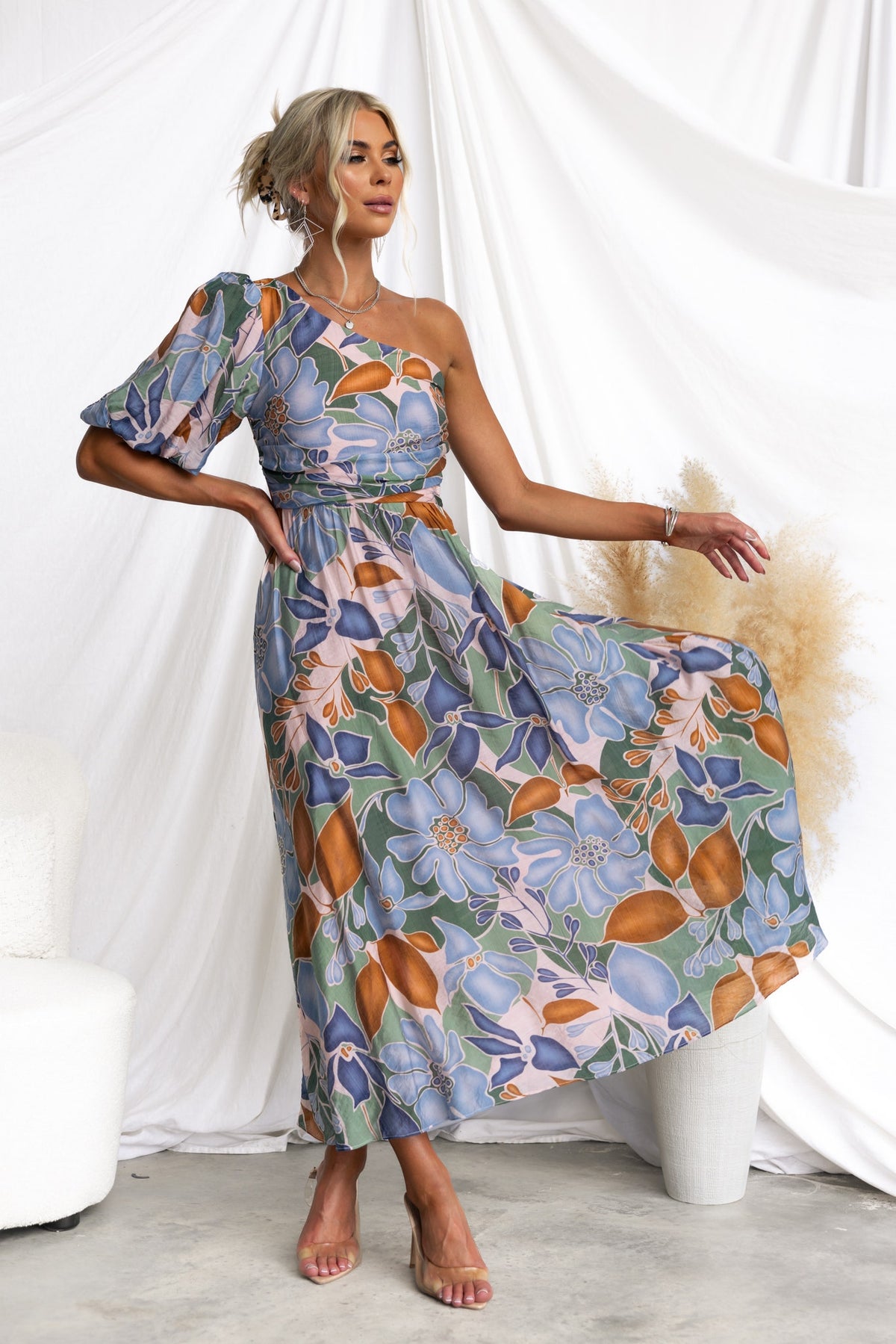 Floral print Woran midi dress with one-shoulder neckline and anti-slip bust, model showcasing style.