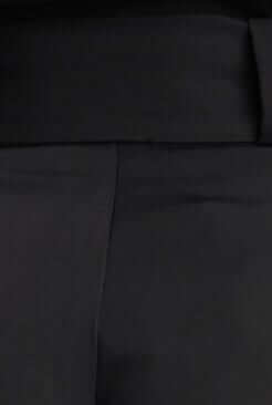 Close-up of Jaspin Pants featuring a black paper bag waist and smooth fabric texture.