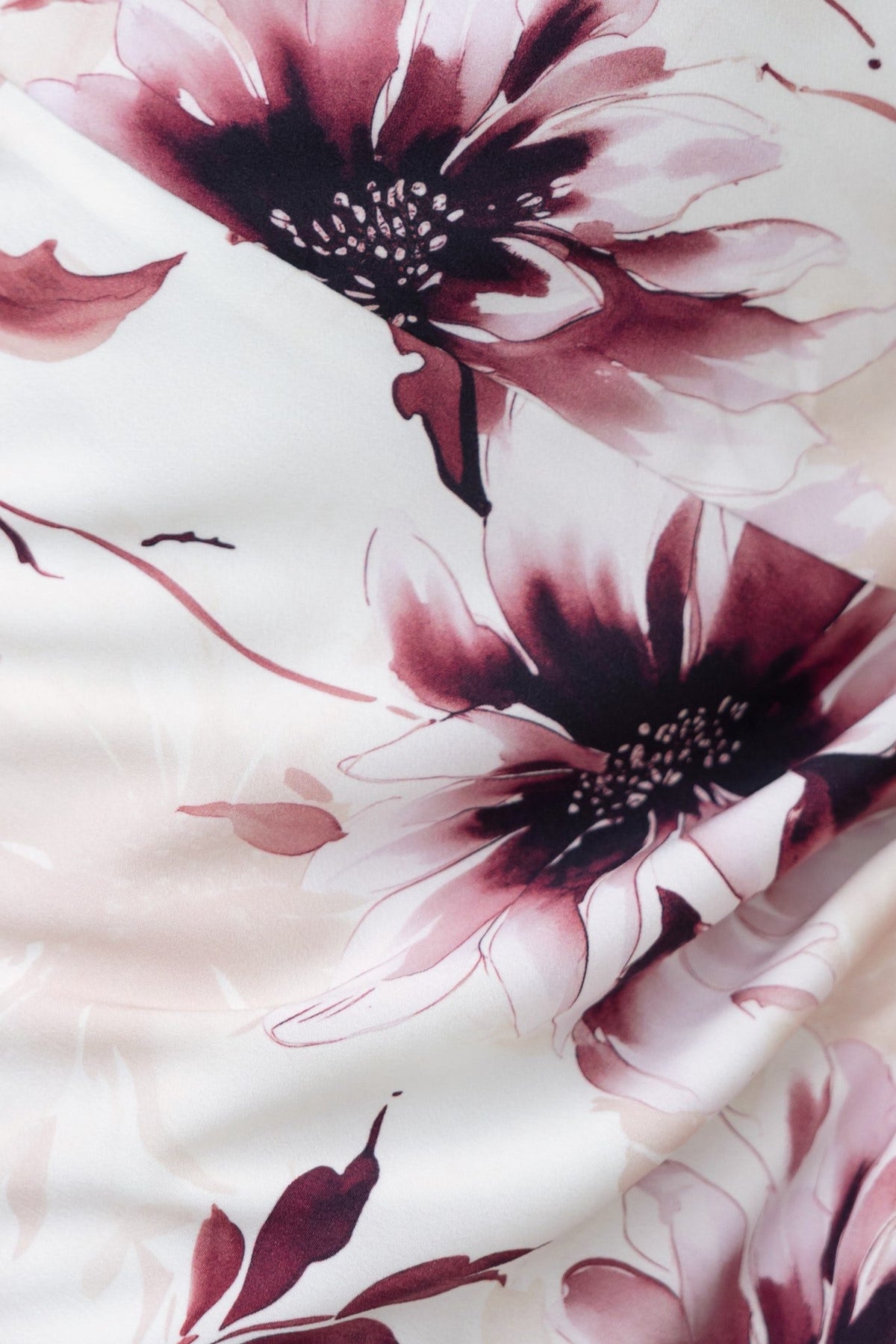 Close-up of floral print on Briley Maxi Dress featuring blush and dark burgundy flowers on a soft fabric.