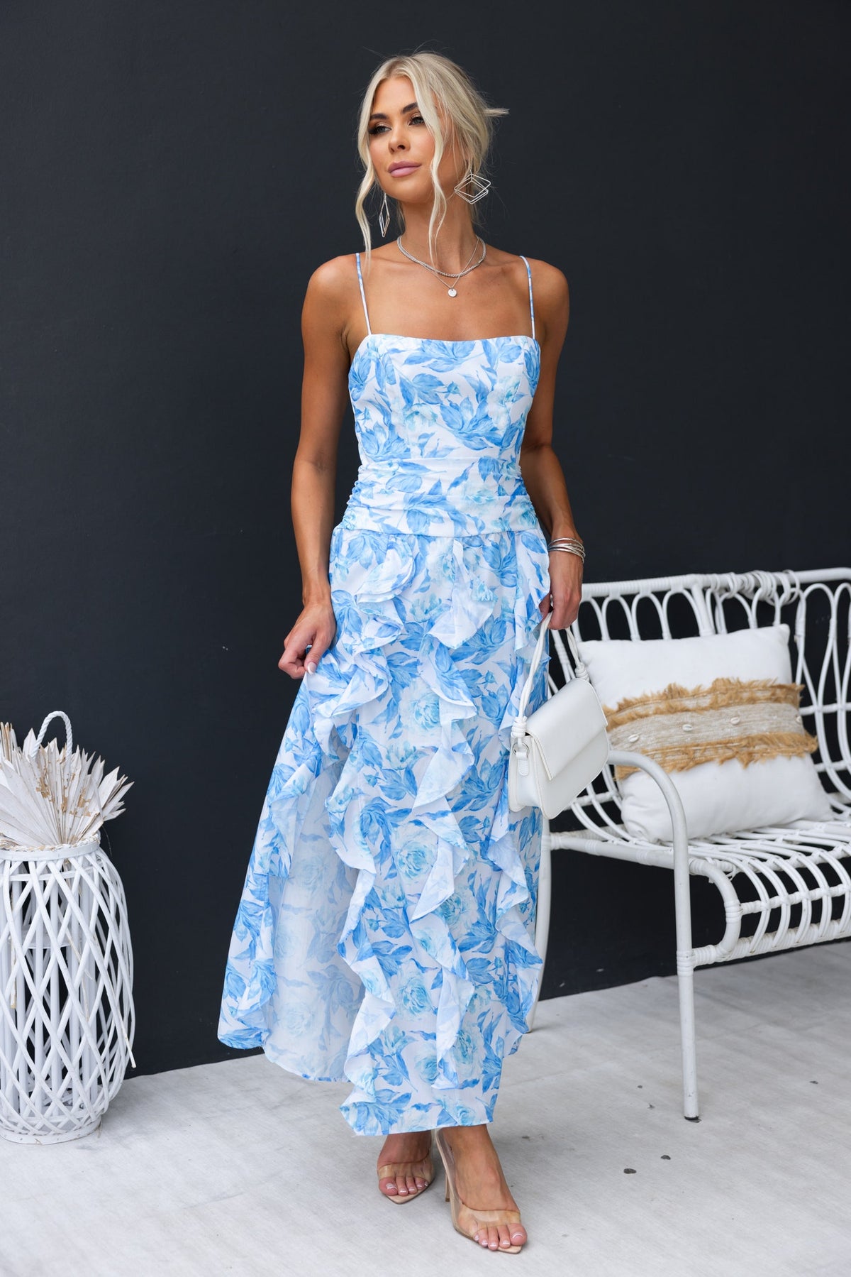 Genovia Maxi Dress in blue floral design with ruffle details, perfect for summer occasions.