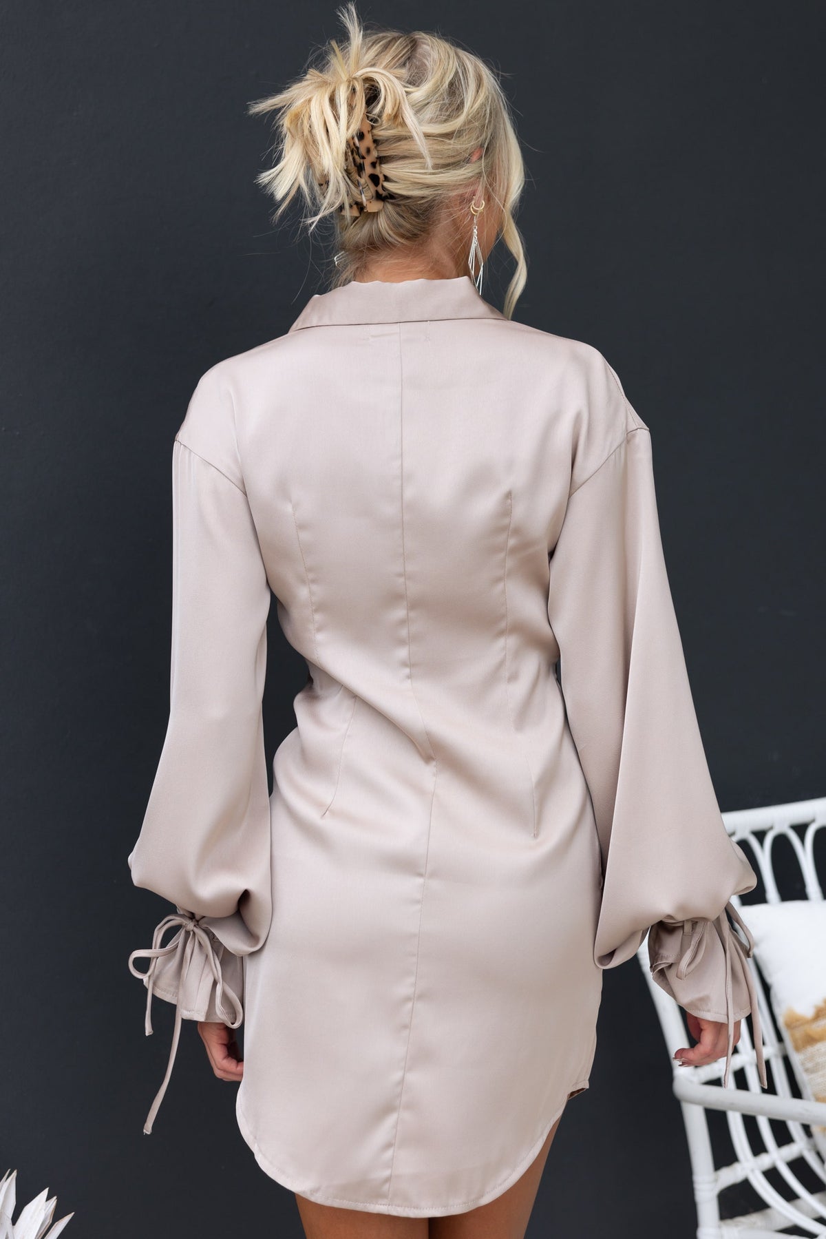 Back view of Naylor Dress featuring a cowl neckline, button-up waist, and tie detailing on sleeves in soft satin finish.