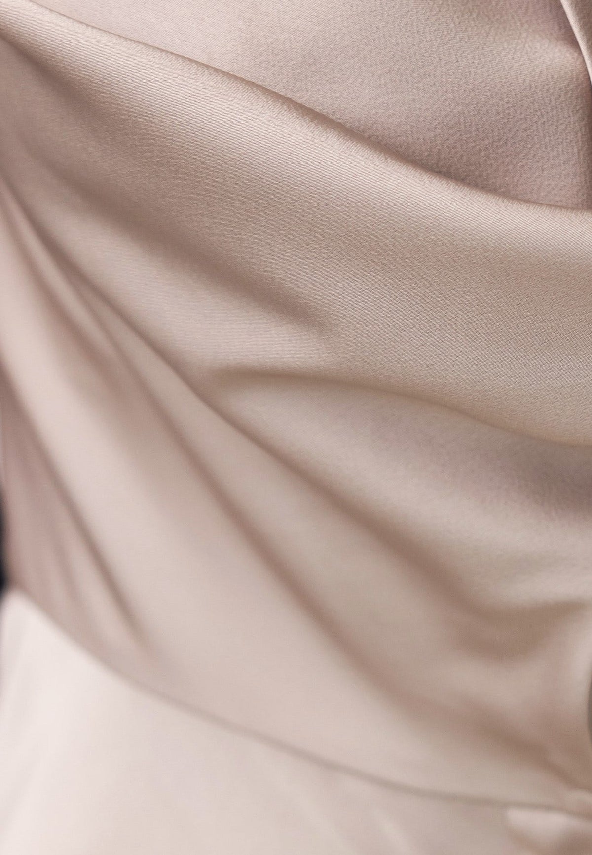 Close-up of the Naylor Dress fabric showcasing its satin look and smooth texture.