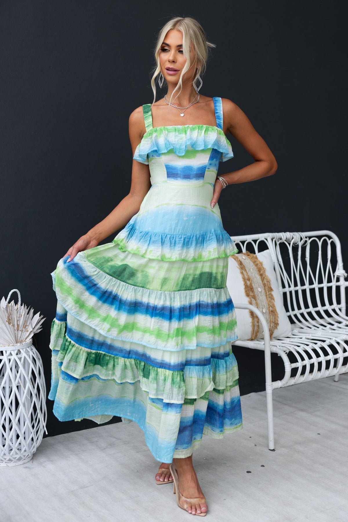 Fondar Maxi Dress in blue and green stripes, featuring ruffle details and a fitted bodice, perfect for summer occasions.