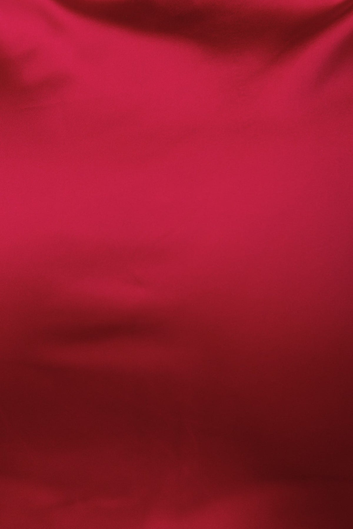 Close-up of luxurious red satin fabric, showcasing a smooth and elegant texture, ideal for fashion garments.