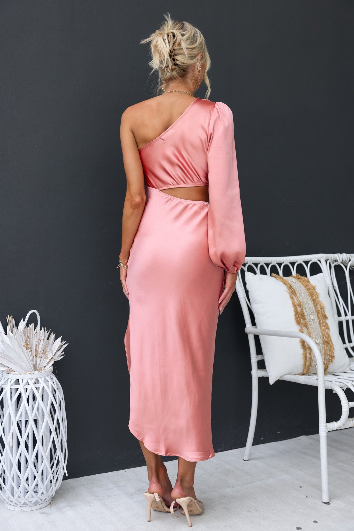 Jeyne Midi Dress in soft pink satin, featuring a one-shoulder design and a chic asymmetric hem.