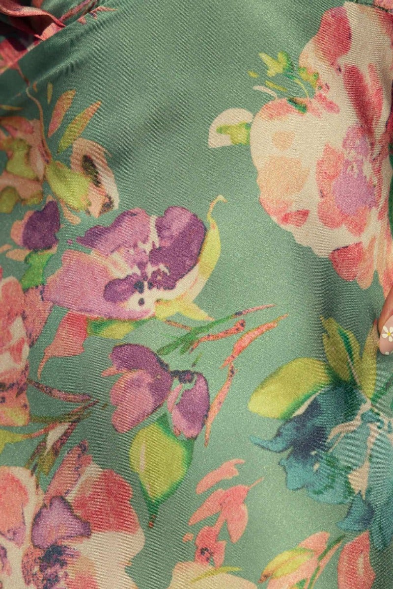 Vibrant floral print fabric of the Live In Colour Maxi Dress featuring pink, purple, and green hues.