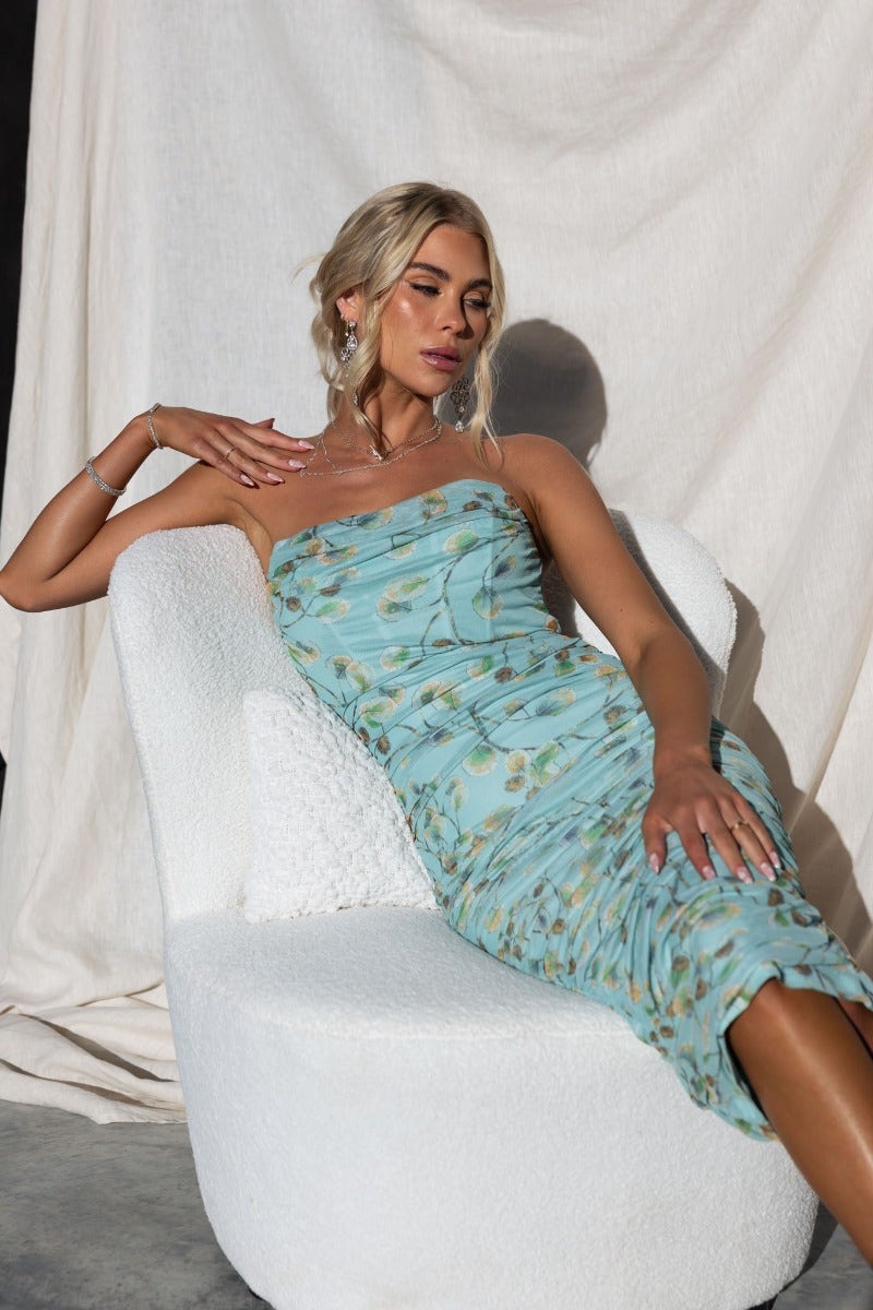 Brailey Midi Dress with mesh overlay, gathered detail, strapless style, and ruched sides in blue floral pattern.