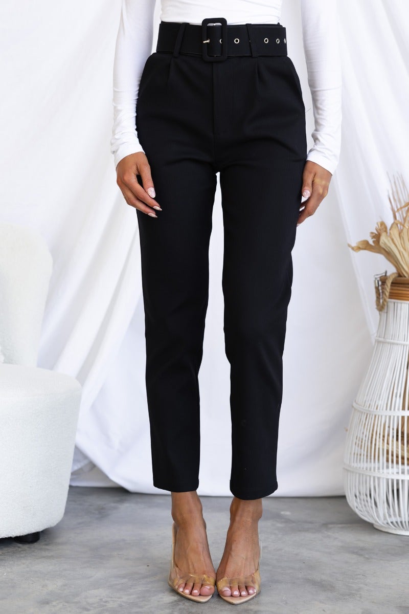 Black dress pants with belt, front and faux pockets, model wearing size 6/XS, stylish slim fit.
