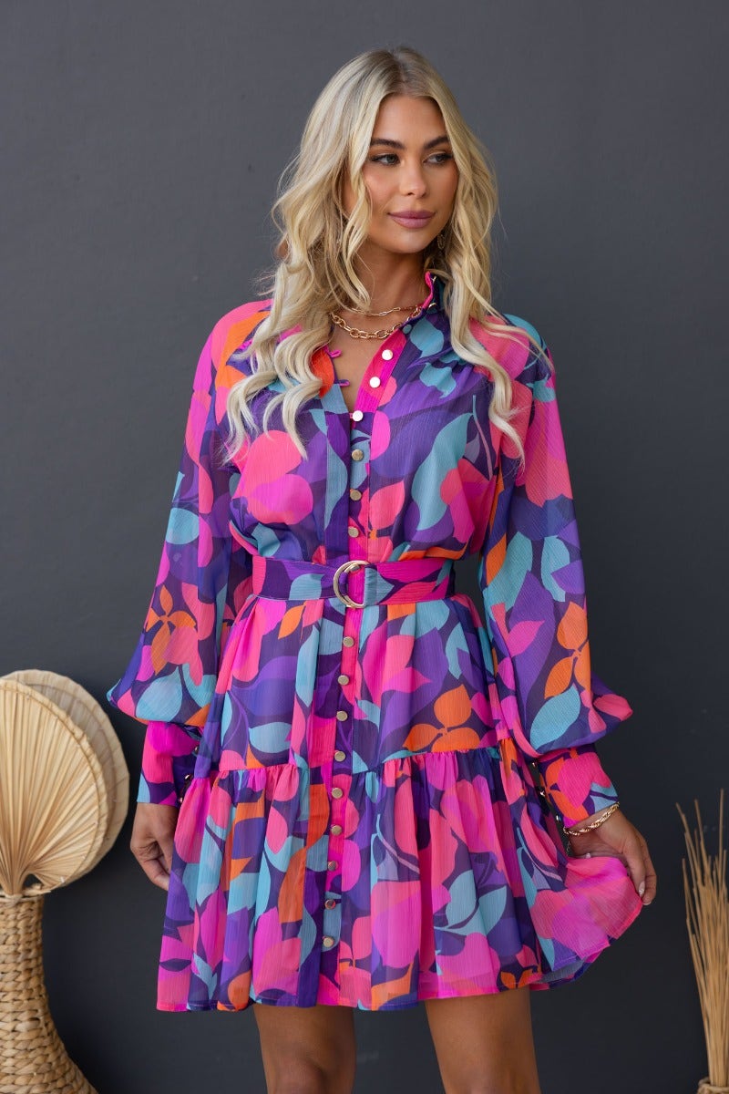 Vibrant multi-colour print Orazio dress featuring a high neckline, button-up front, and removable belt for a defined shape.