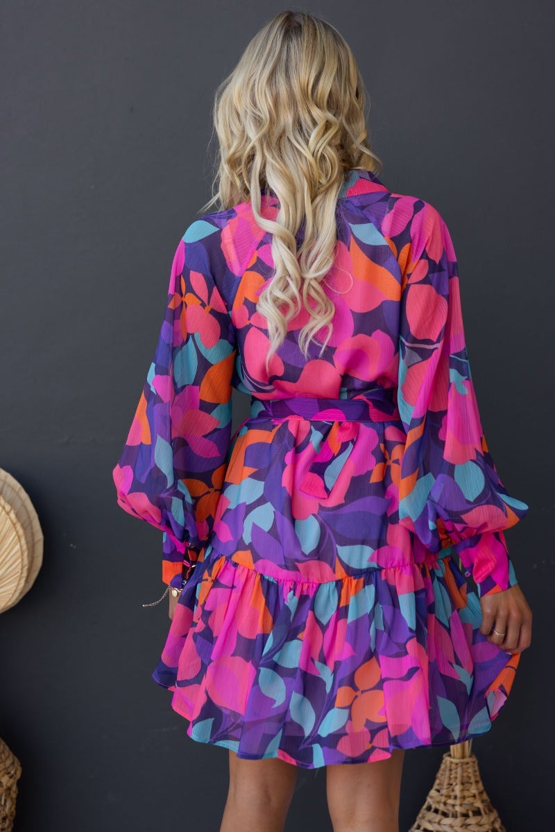 Orazio Dress in vibrant multi-colour print, featuring a high neckline, button-up front, and relaxed fit with a removable belt.