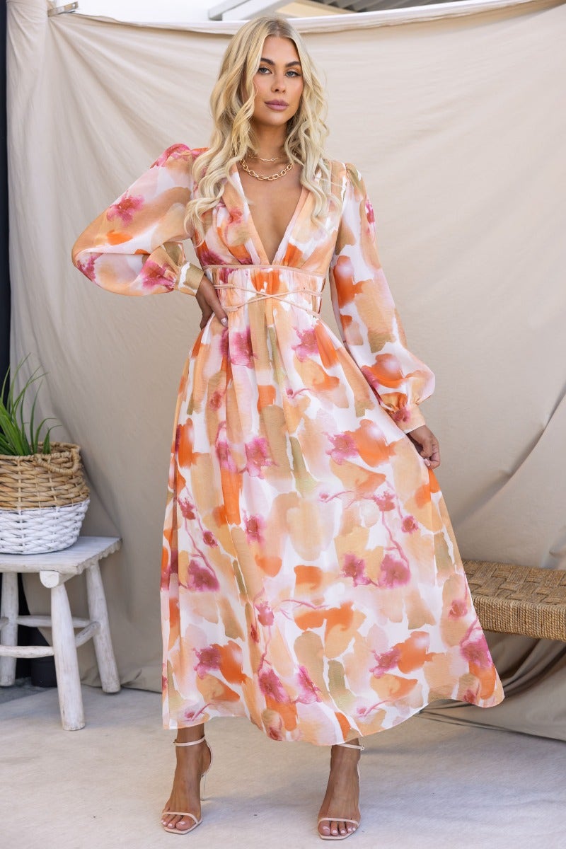 Picturesque multi-colour maxi dress with V-neckline, elastic waistband, and long sleeves, perfect for a stylish summer look.