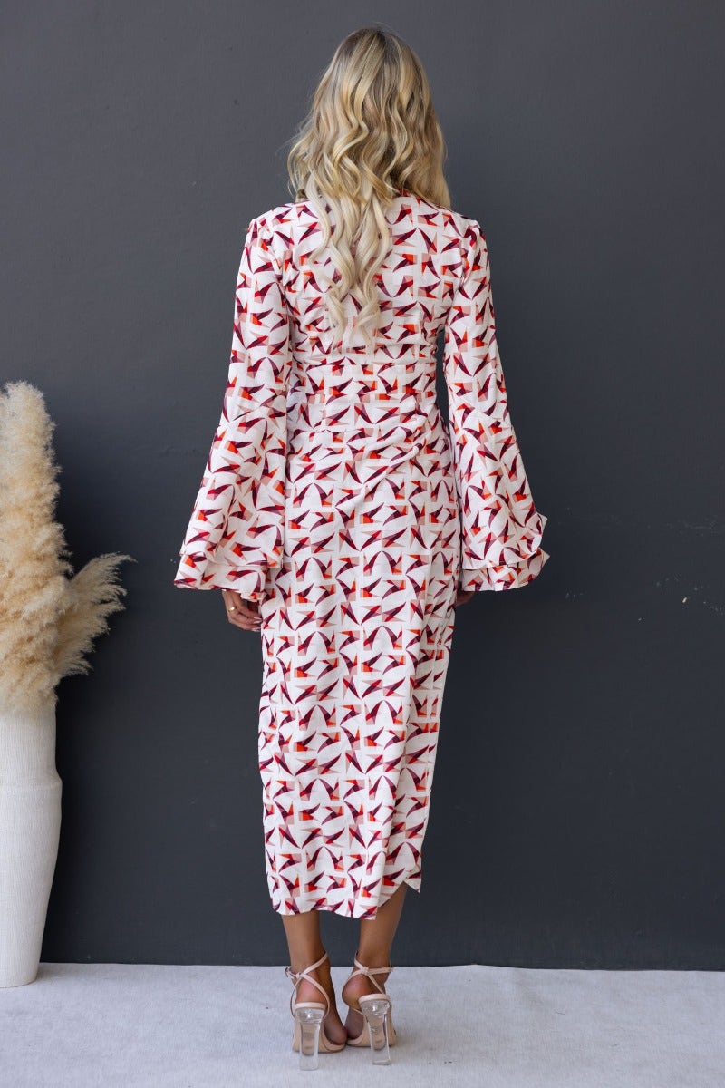 Back view of Kiran Maxi Dress featuring multi-colour print, V-neckline, flare sleeves, and a split front.