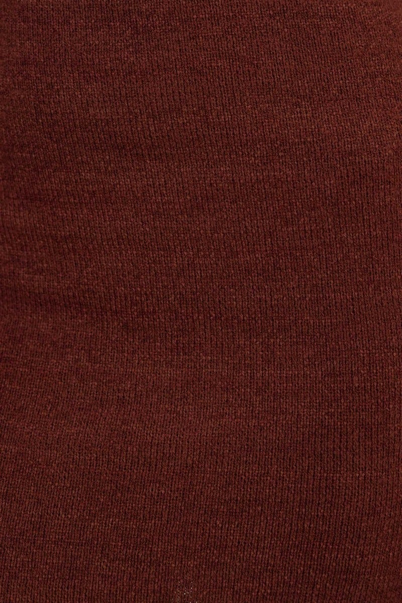 Close-up of rich brown knit fabric, showcasing texture and stretch, ideal for stylish garment design.