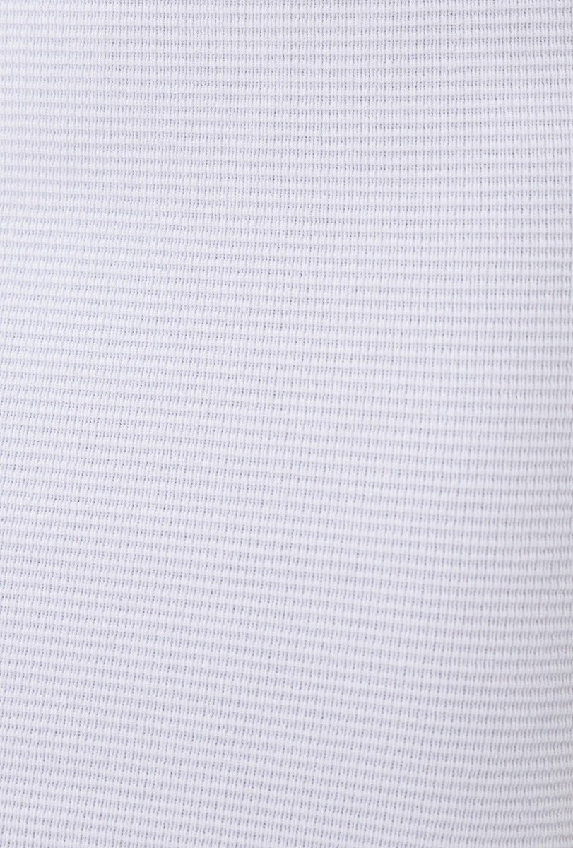Close-up of ribbed knit material in white, showcasing texture suitable for Huxley Top, a stretchy and stylish shirt.