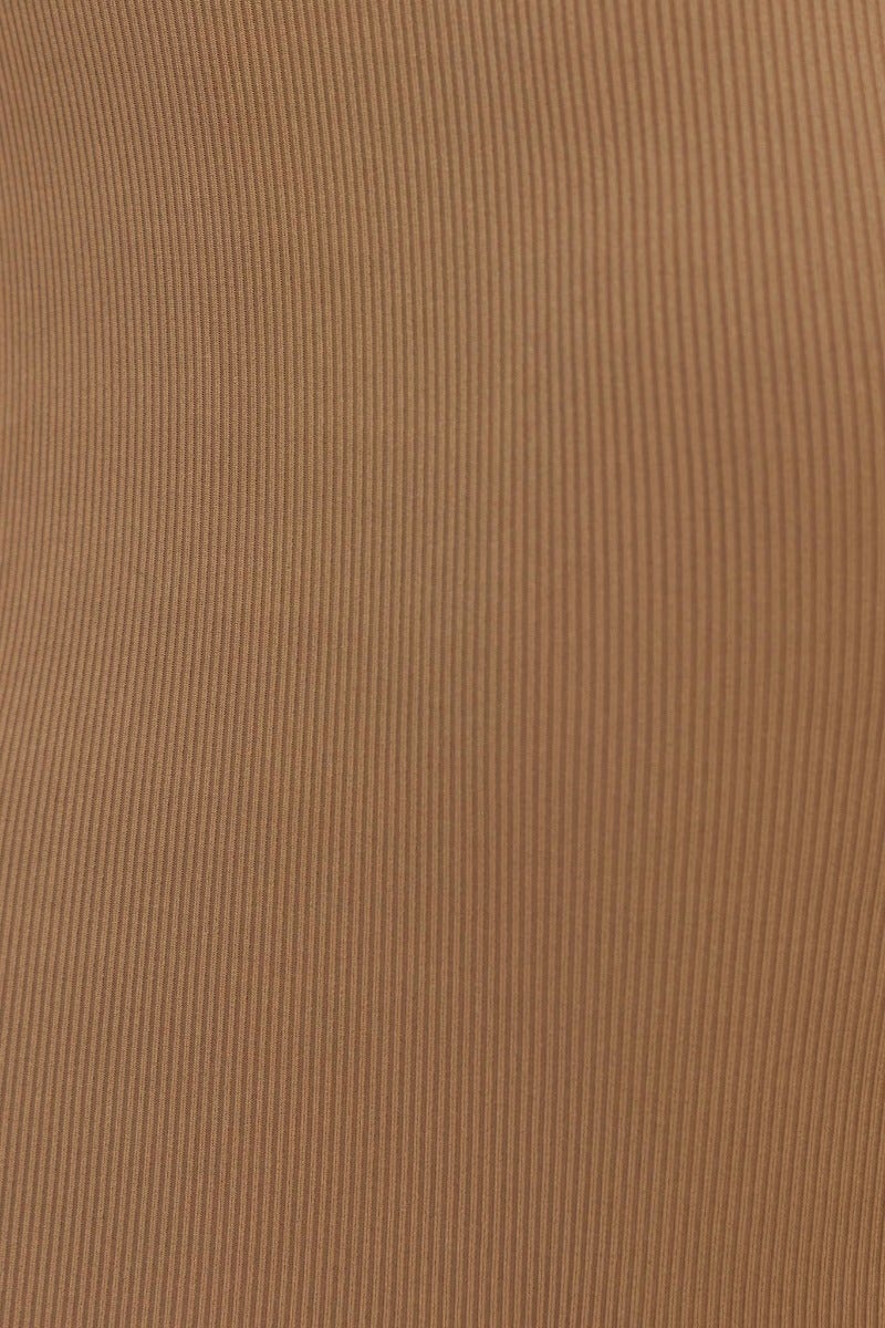 Close-up of ribbed fabric in tan color, showcasing texture for the Fernanda Midi Dress.