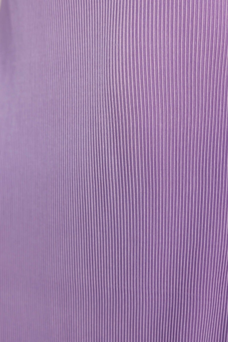 Close-up of accordion pleat amethyst top in purple fabric, featuring fine vertical stripes and soft texture.