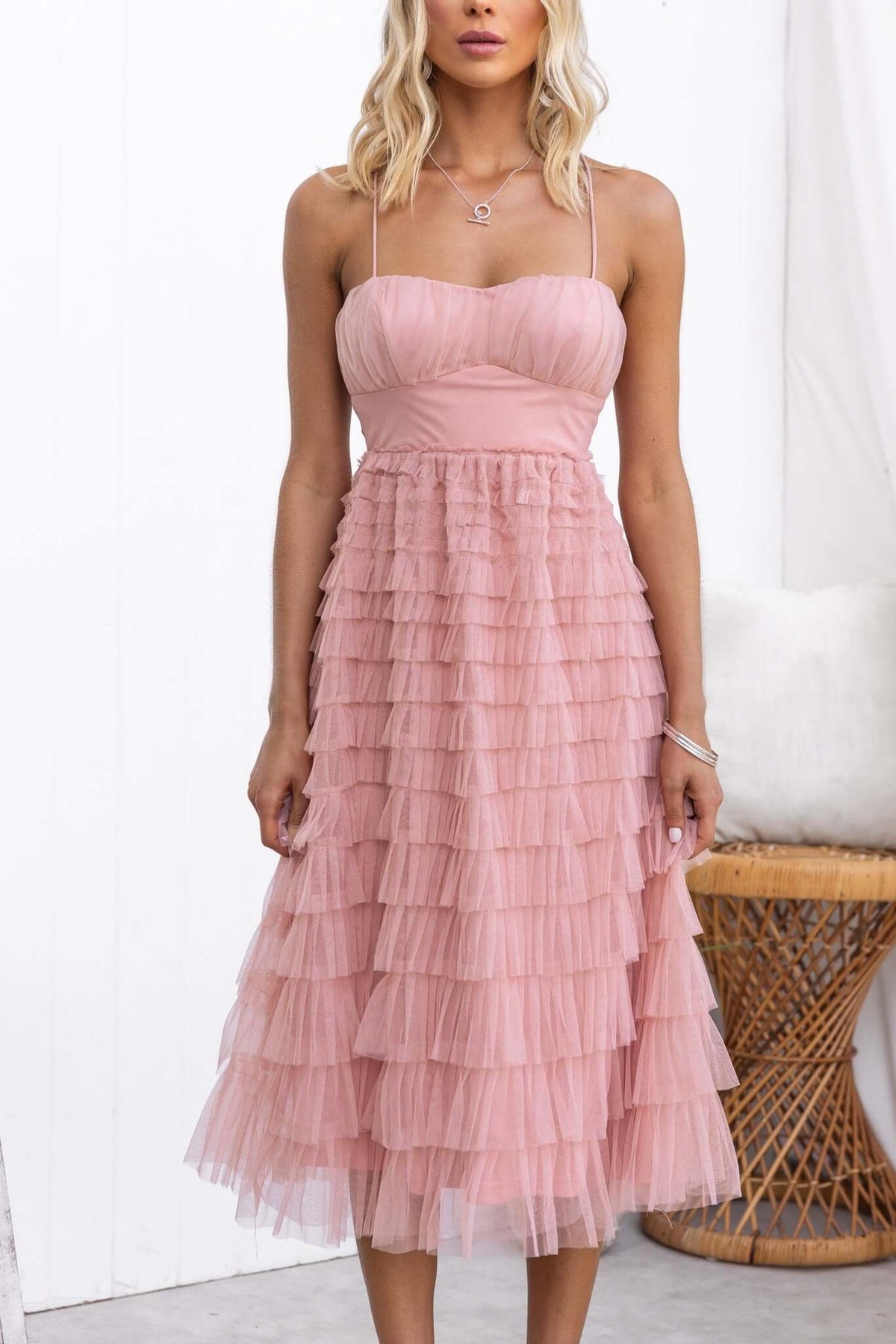 Vittoria Midi Dress with adjustable tie straps and layered tulle, showcasing a stylish pink design, perfect for special occasions.