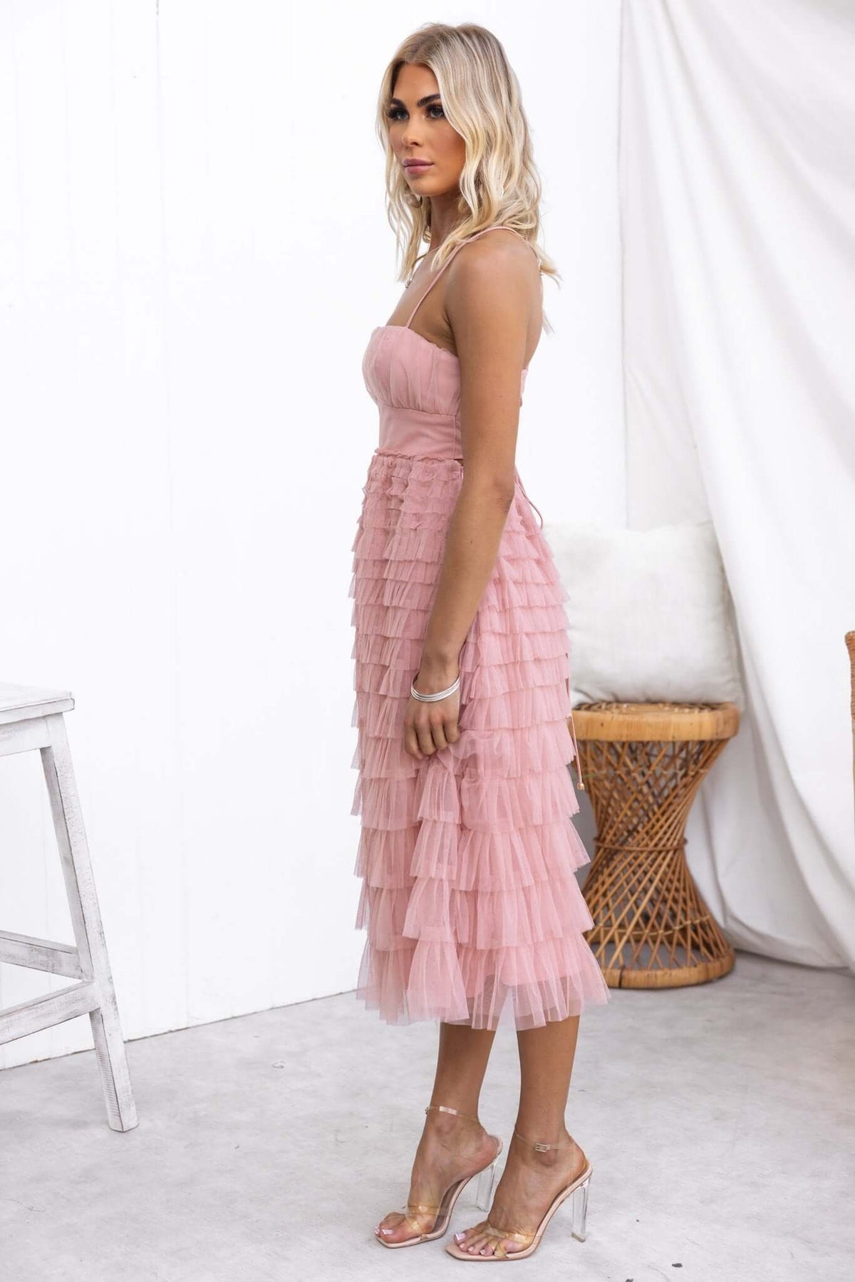Vittoria Midi Dress in soft pink, featuring layered tulle design, adjustable straps, and stylish cut-out back.