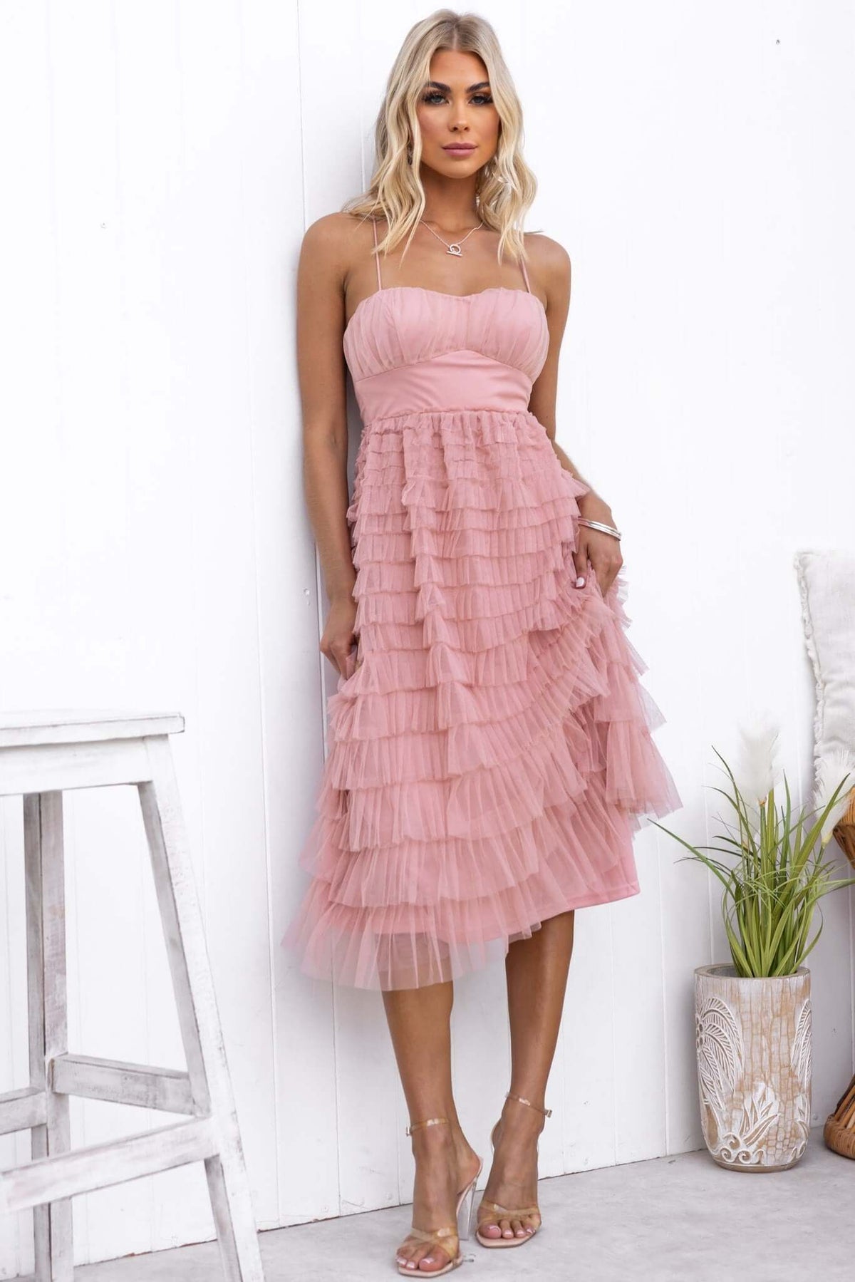Vittoria Midi Dress in soft pink tulle with layered ruffles and adjustable straps, perfect for summer events.
