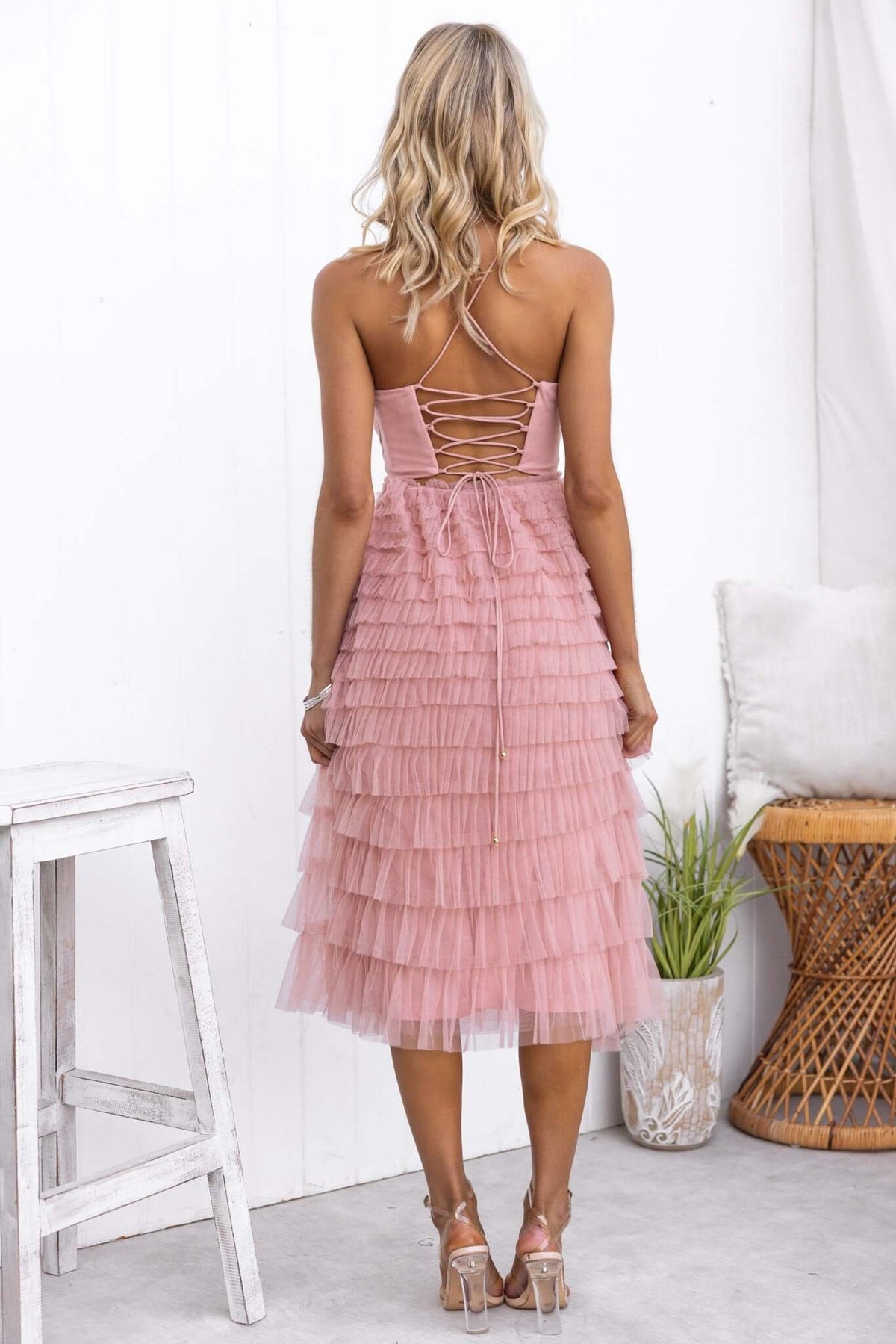 Back view of Vittoria Midi Dress featuring adjustable tie straps and Tulle material in soft pink.