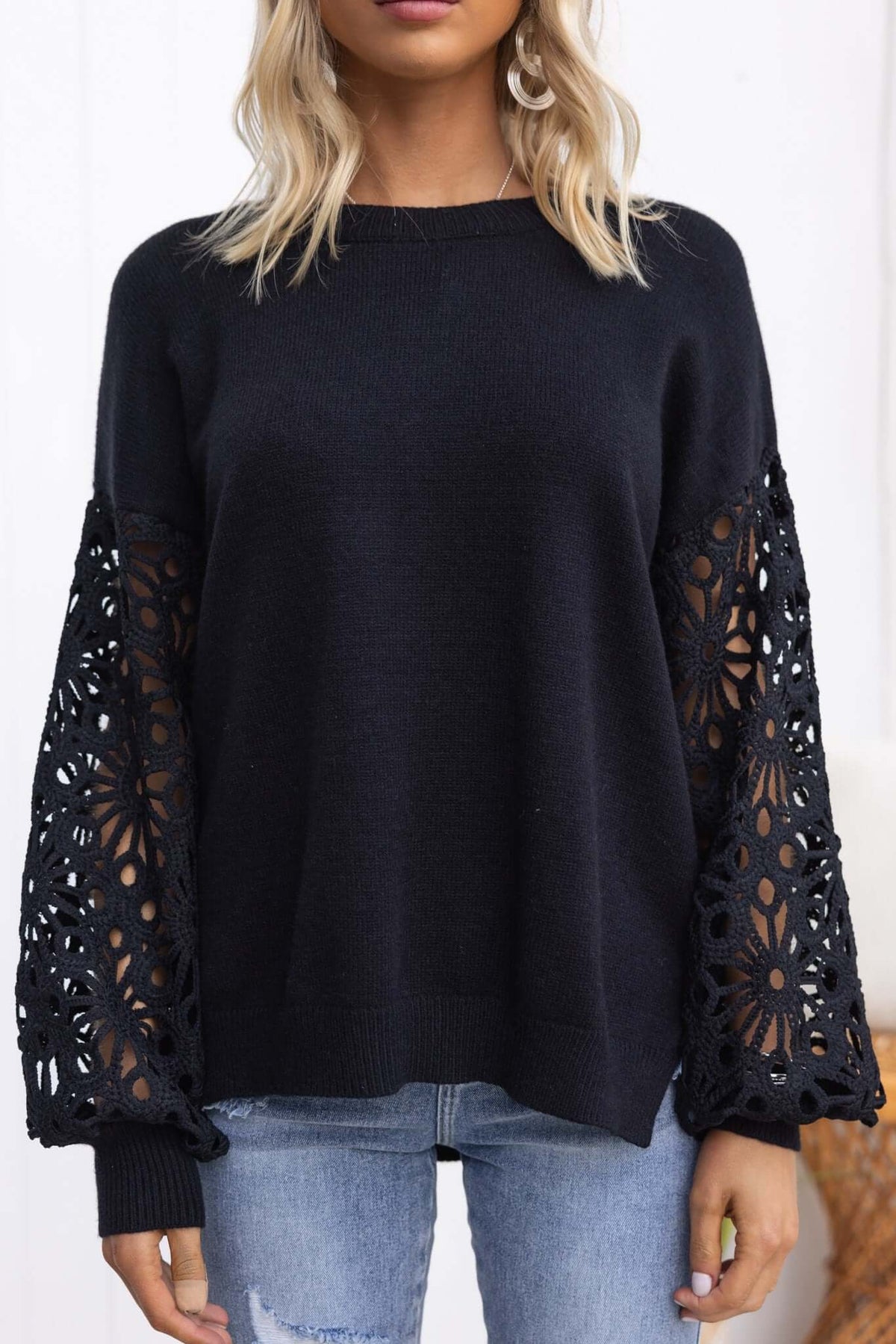 Mooney Jumper in black with crochet sleeves, round neckline, and a relaxed fit, perfect for stylish layering.