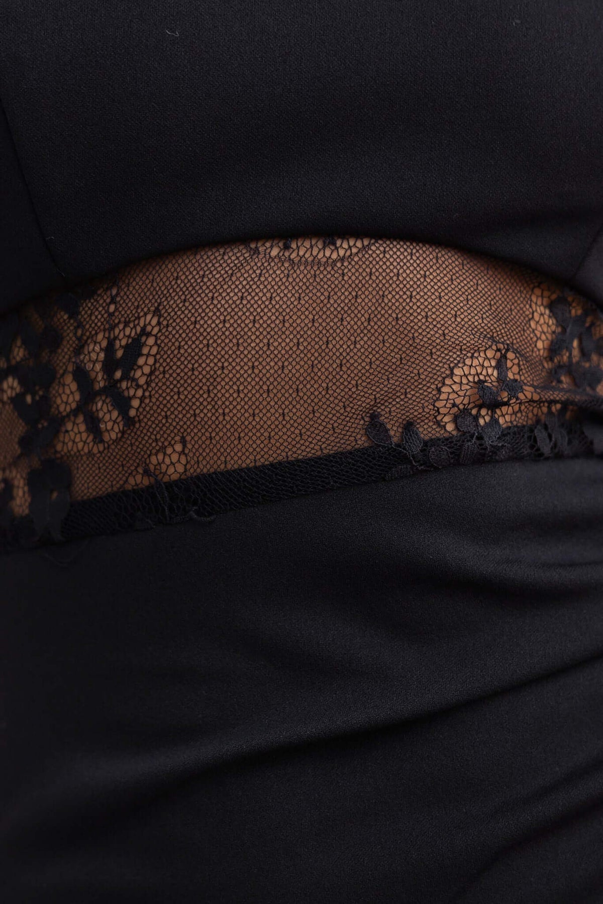 Close-up of Sassari Maxi Dress showcasing black lace panel detail at the waist with mesh inset for an elegant look.