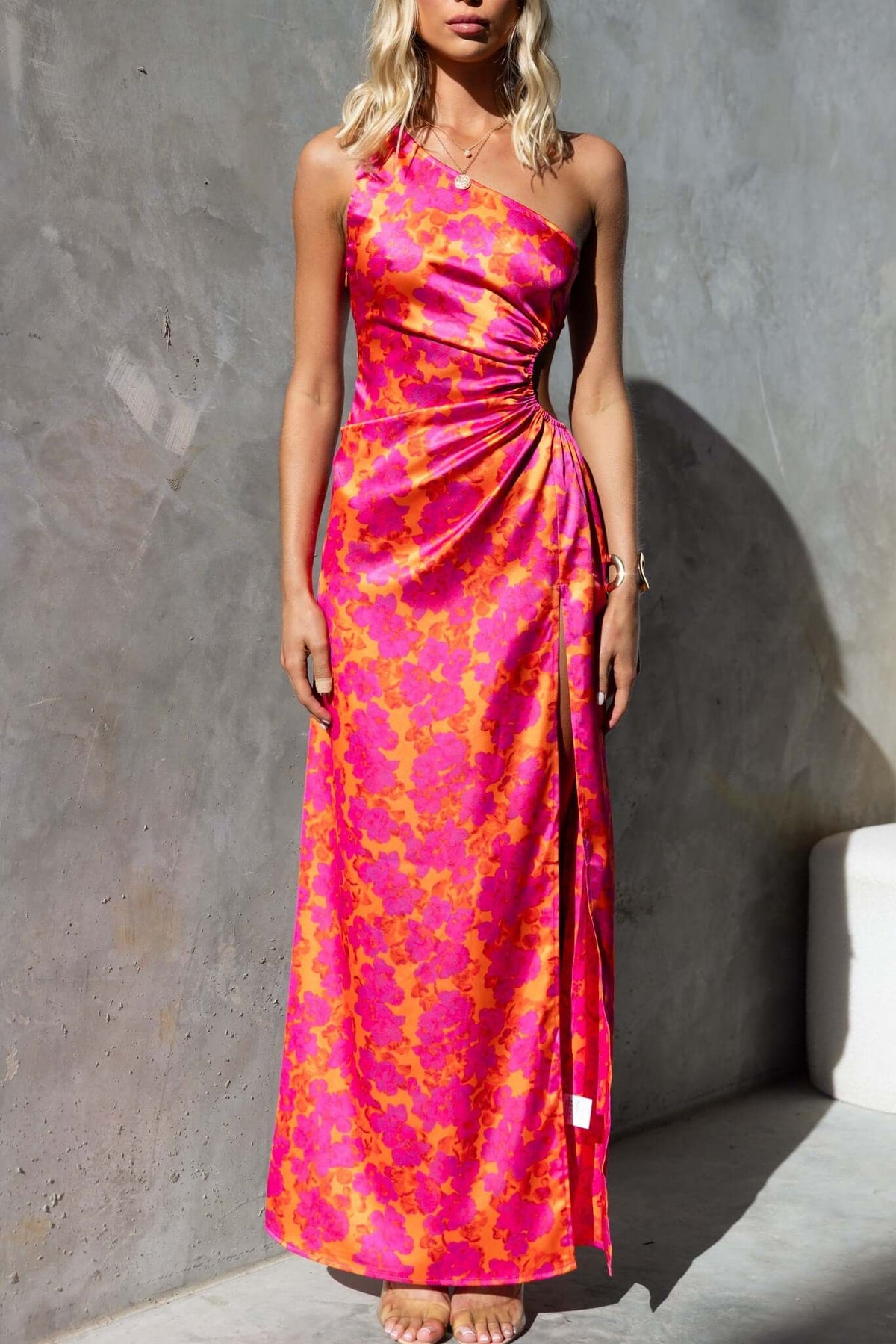 Carey Maxi Dress in floral print with one-shoulder design, high split, and elastic cut-out at waist.