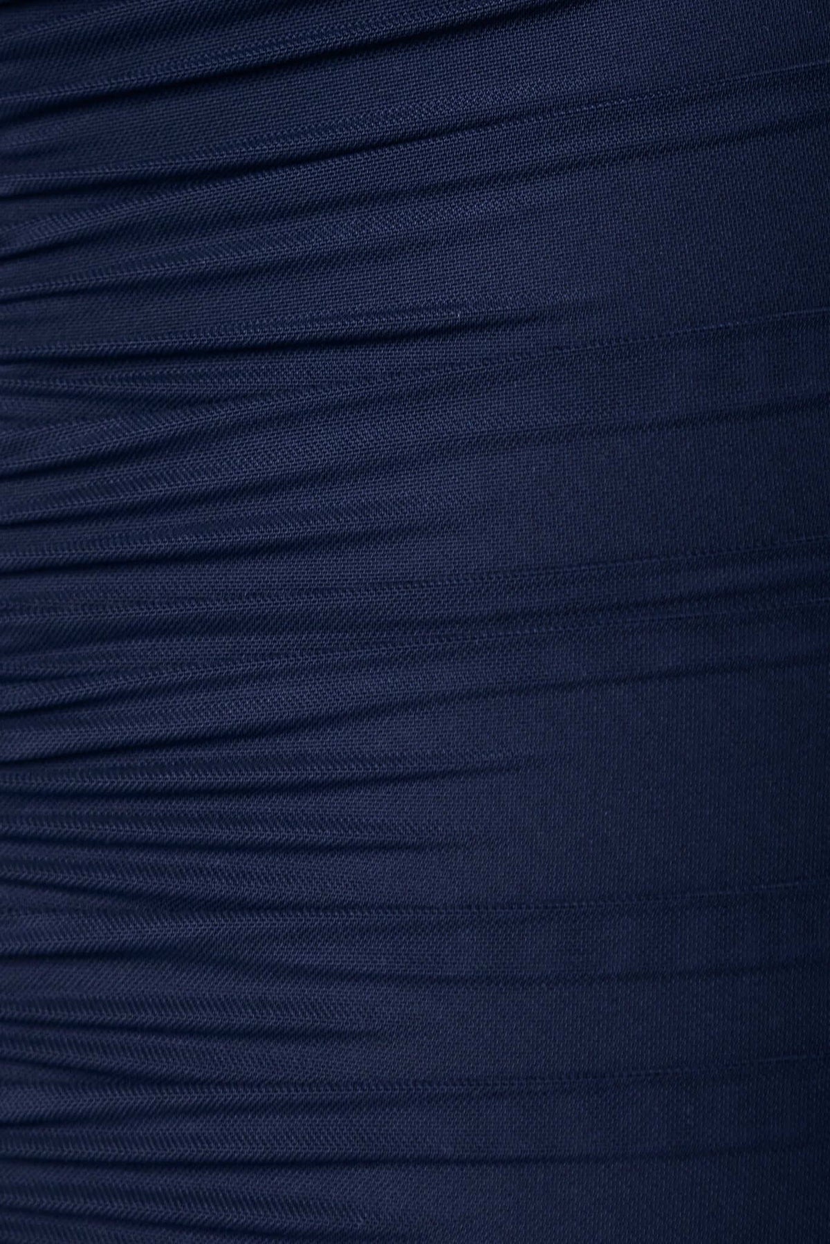 Navy ruched fabric detail of a Rosetta Maxi Dress, showcasing its textured design and stretch material.