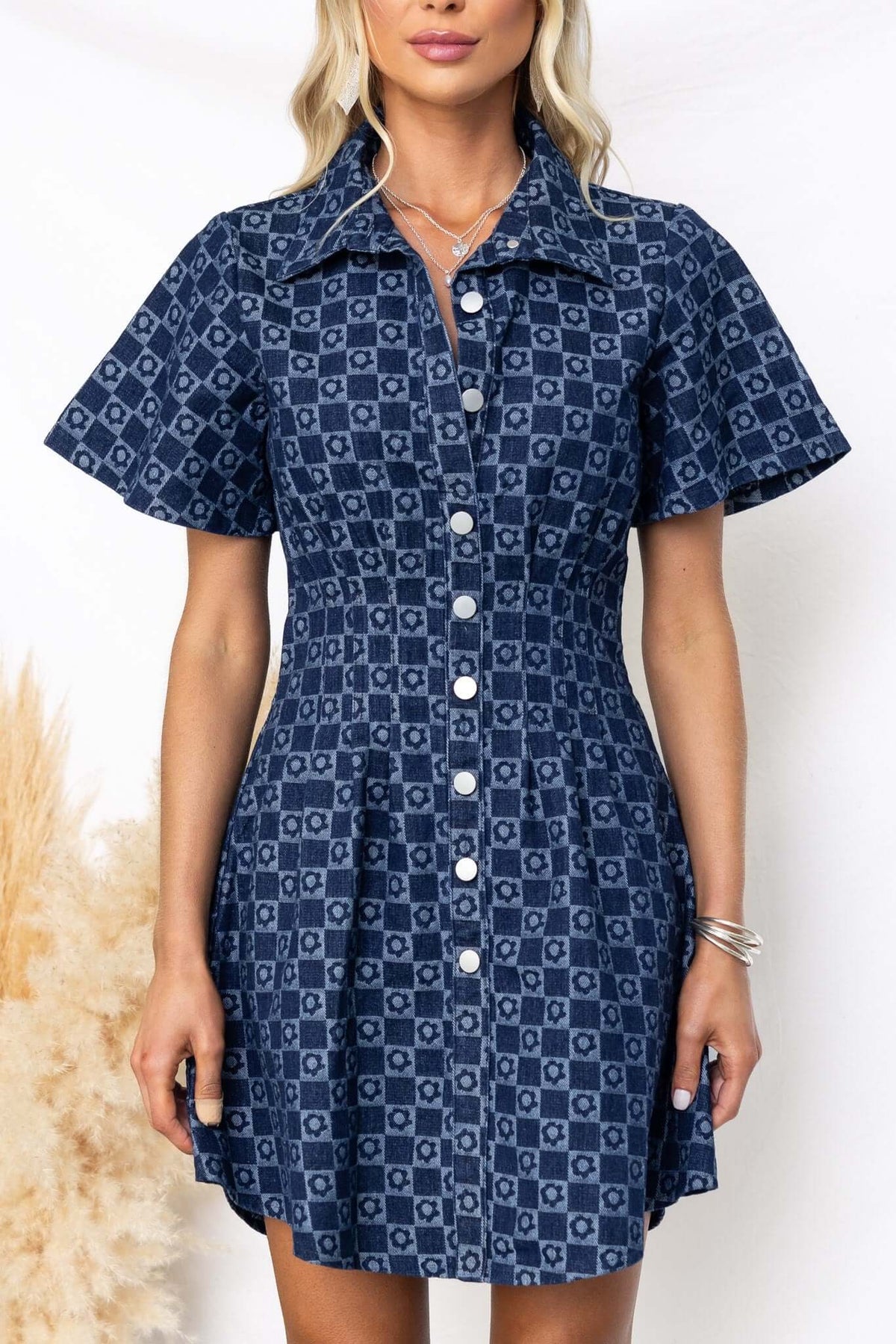Mara Denim Dress with collar and faux button-up front, featuring short sleeves and a fitted silhouette in navy blue.
