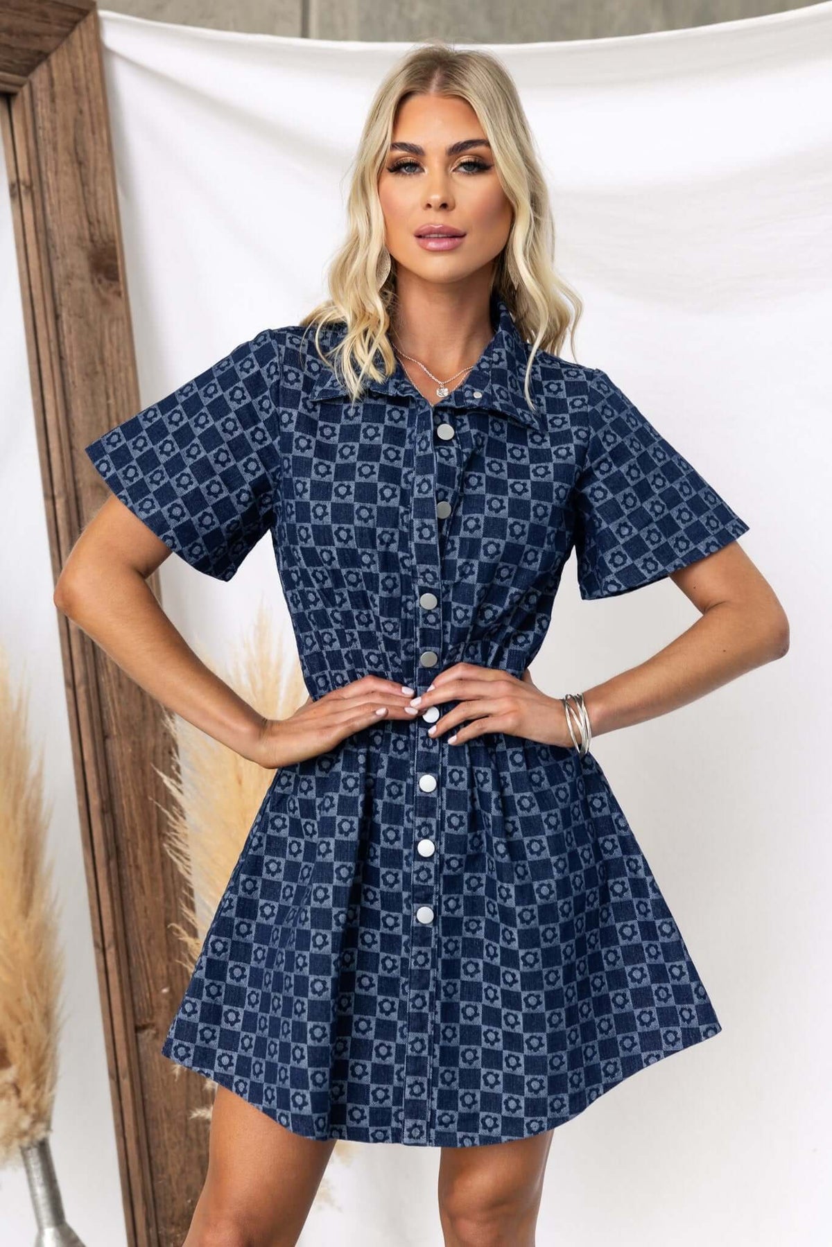Mara Denim Dress featuring a short sleeve design, faux button-up front, and cinched waist in denim fabric.