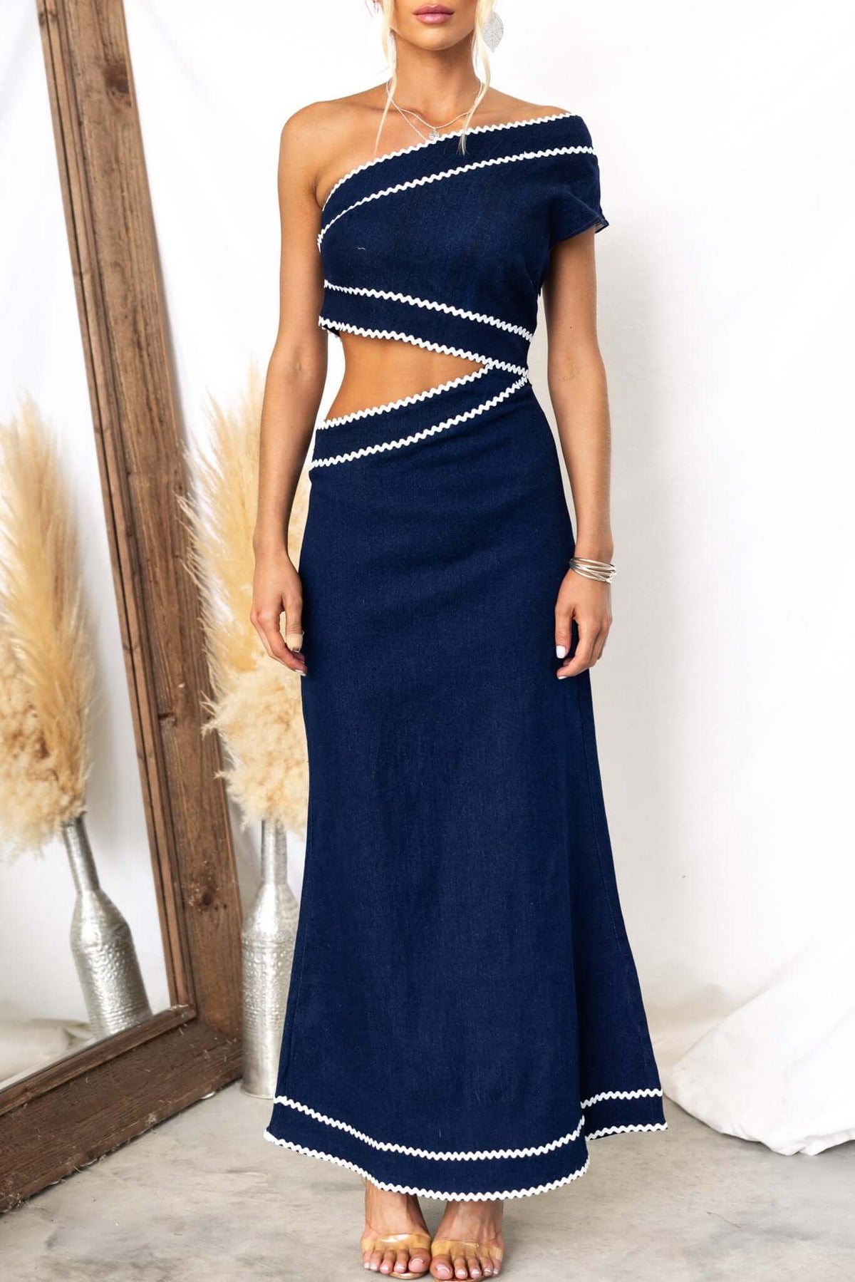 Favara Denim Maxi Dress in navy, featuring a one-shoulder design and stylish cut-out at the waist.