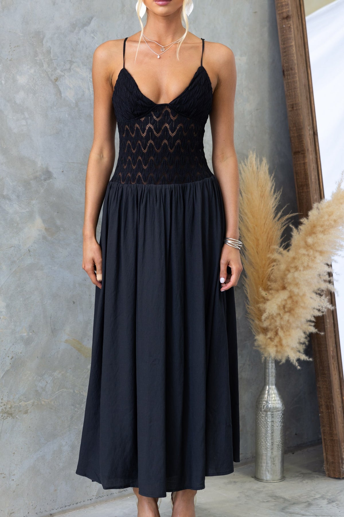 Thaisa Maxi Dress in black with lace bodice and adjustable straps, featuring a flowy skirt and invisible side zip.