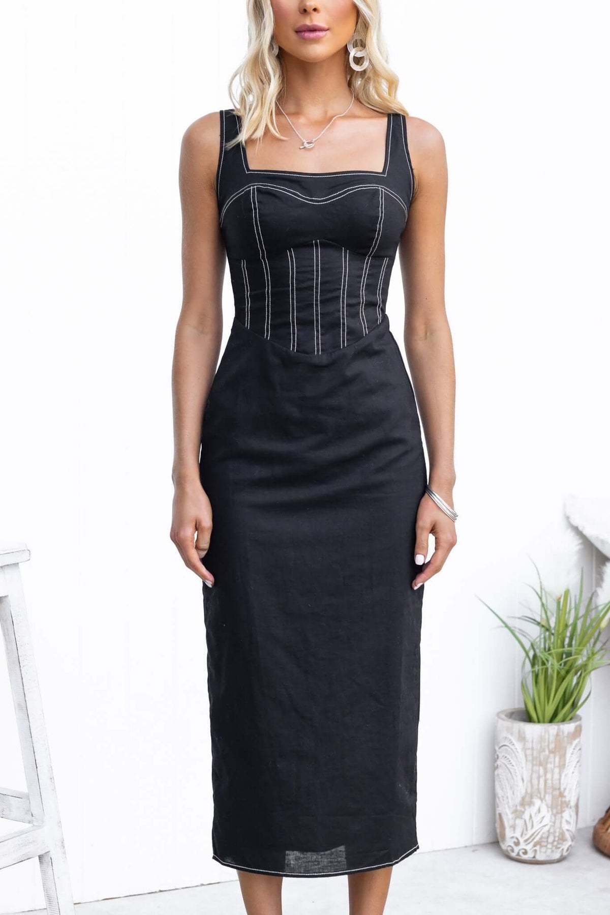 Black Sebille Midi Dress with adjustable straps and back split, showcasing a stylish linen blend design.