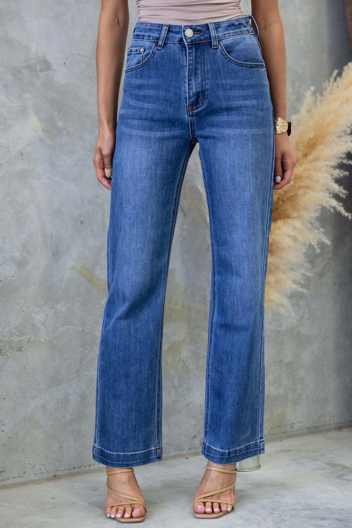 Tonic Jeans featuring a mid-high waist fit, straight leg style with front and back pockets in a light blue denim.