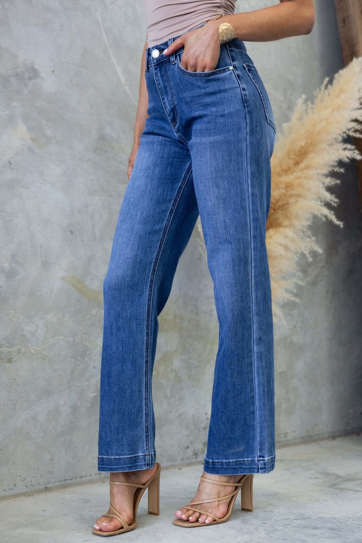 Tonic Jeans featuring mid-high waist, straight leg fit, and stylish denim design.