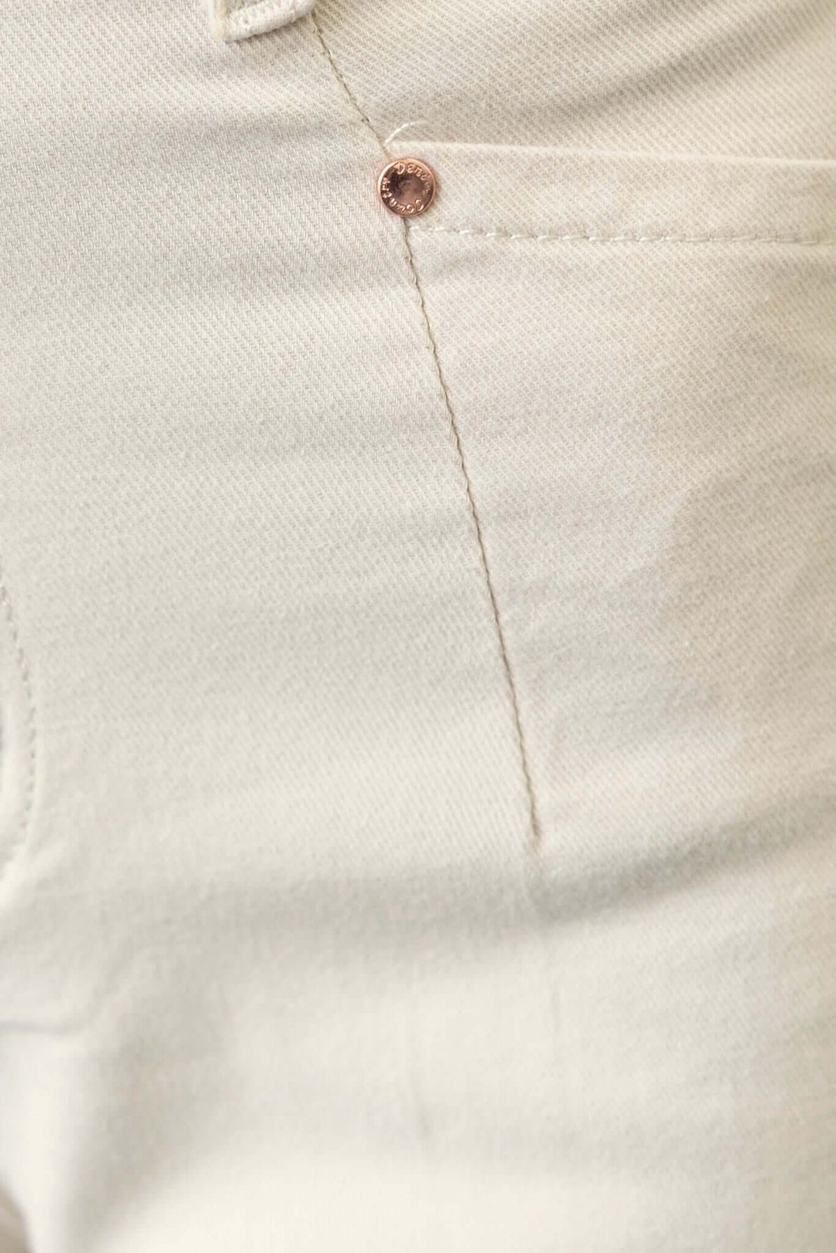 Close-up of Blanca Jeans showing mid-high waist fit and front pocket detail in stretch fabric.
