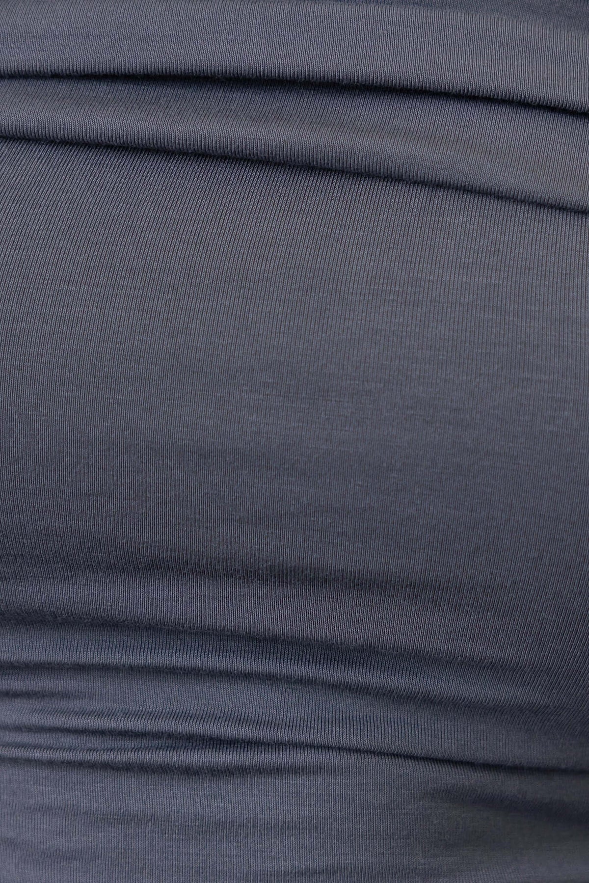 Close-up of soft, stretchy cotton blend fabric in dark gray, showcasing its smooth texture and wrinkle-free appearance.