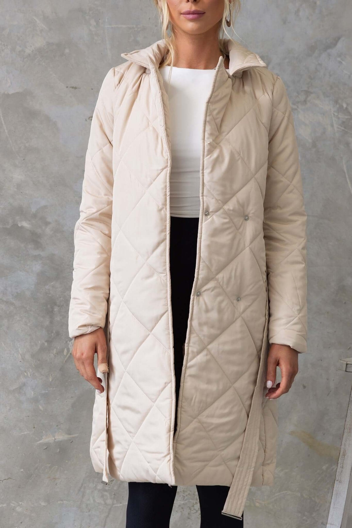 Chantel Coat, longline quilted style with collar and lapel, shown in beige color, featuring front buttons and removable tie.