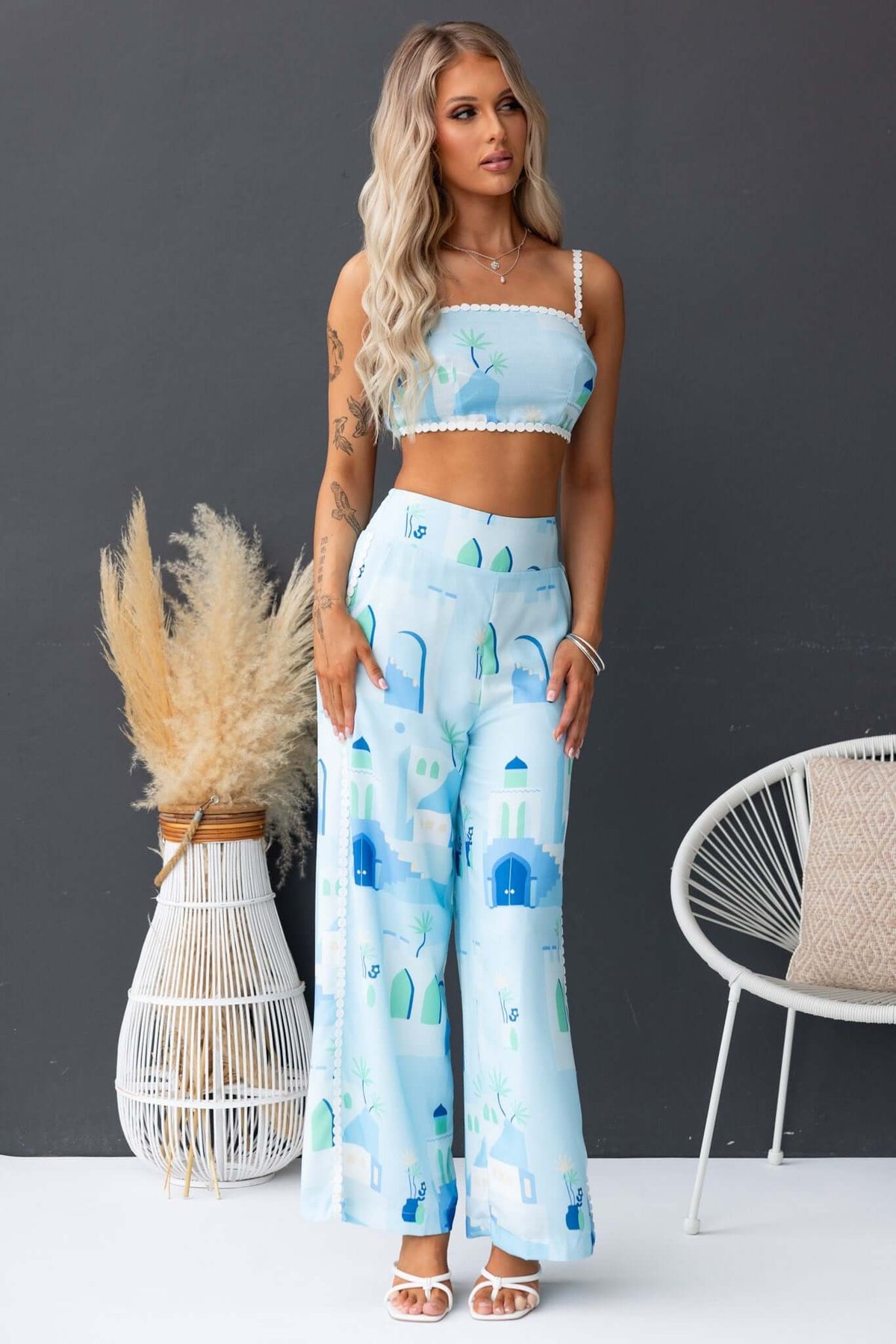 Uriela Top - Blue patterned top paired with wide-leg pants, stylish summer outfit showcasing comfort and elegance.