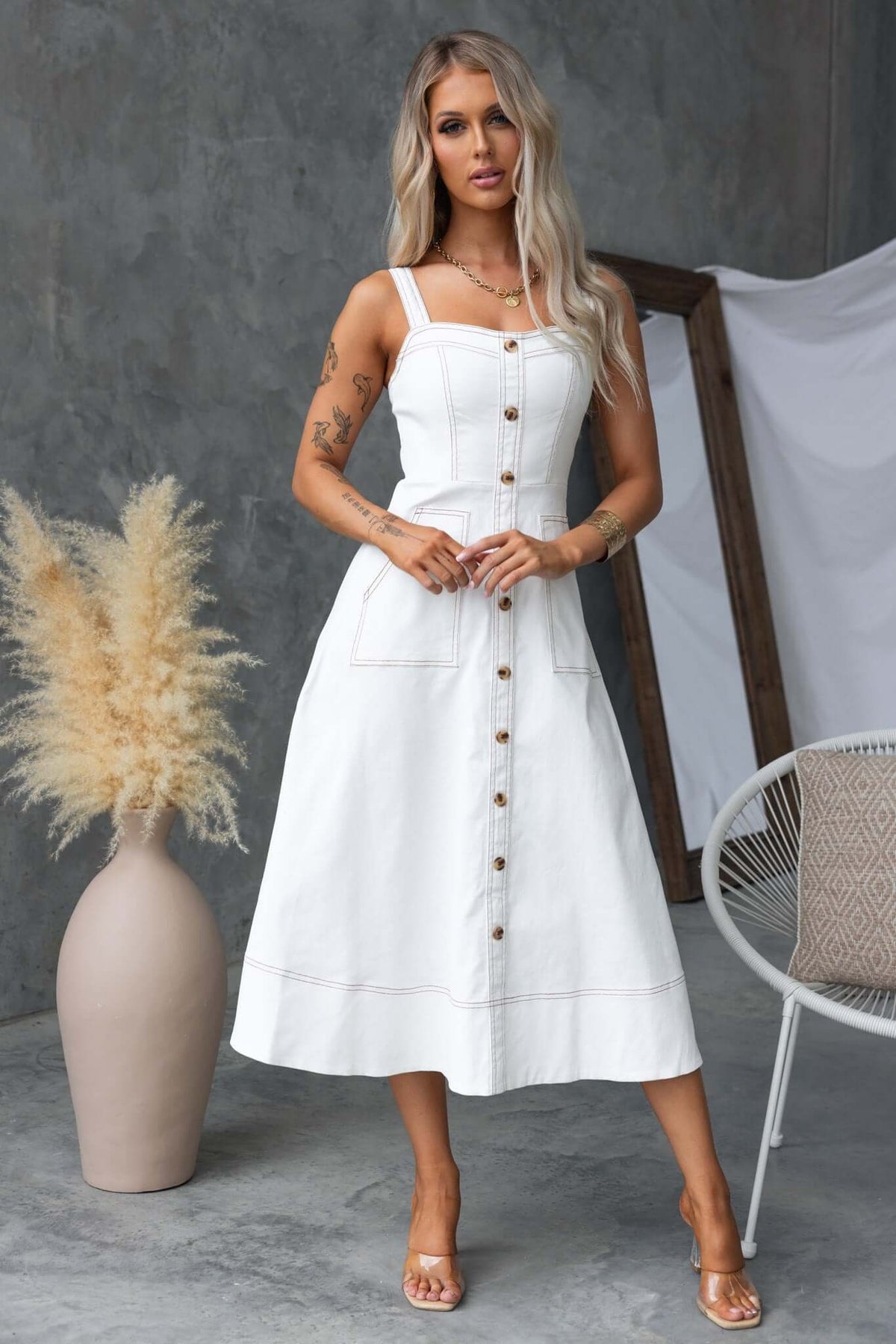 Karta Denim Midi Dress in white with faux buttons and pockets, model wearing size XS, stylish and versatile summer outfit.