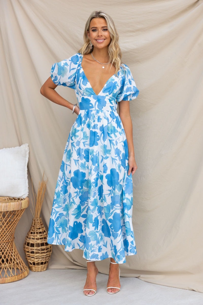 Evalane Maxi Dress featuring a floral print, V-neckline, and tie back detail, perfect for summer occasions.