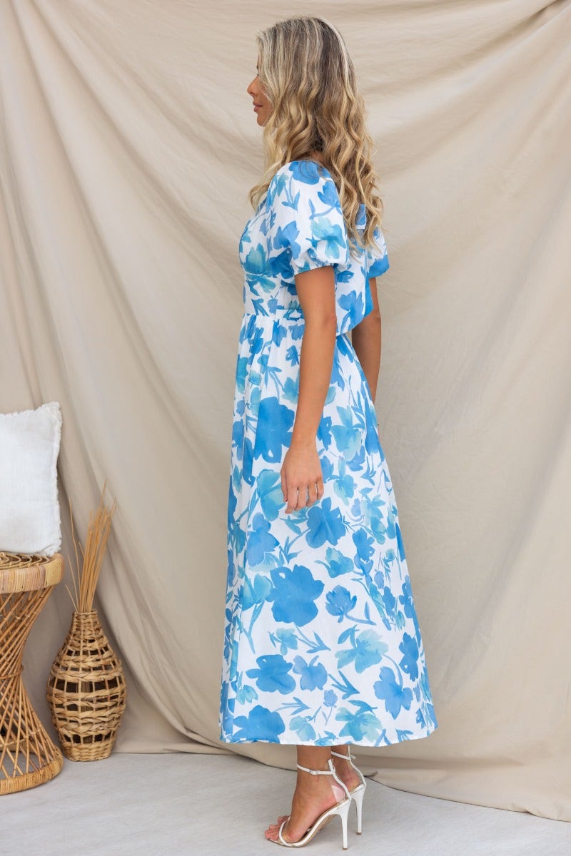 Evalane Maxi Dress featuring a side view of a floral print dress in blue and white, ideal for summer outings.