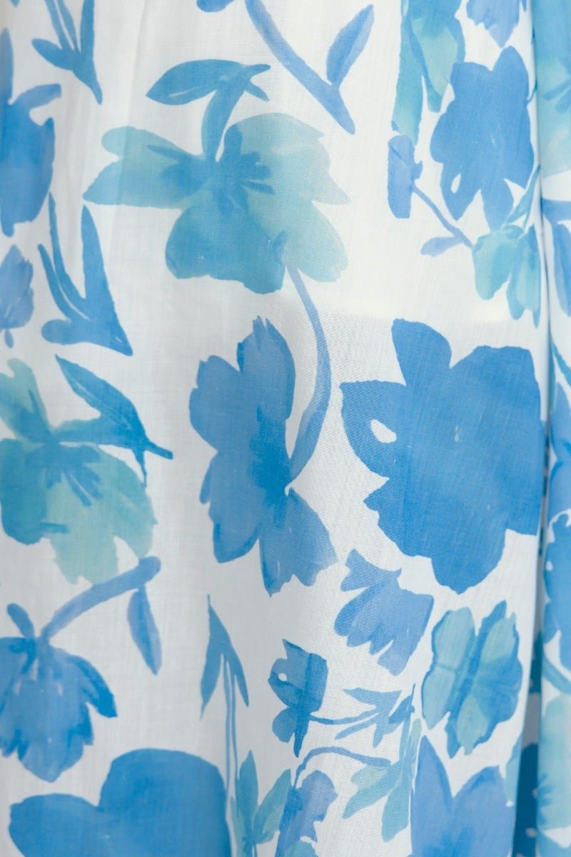 Blue floral print fabric detail of Evalane Maxi Dress, featuring soft blooms on a lightweight background.