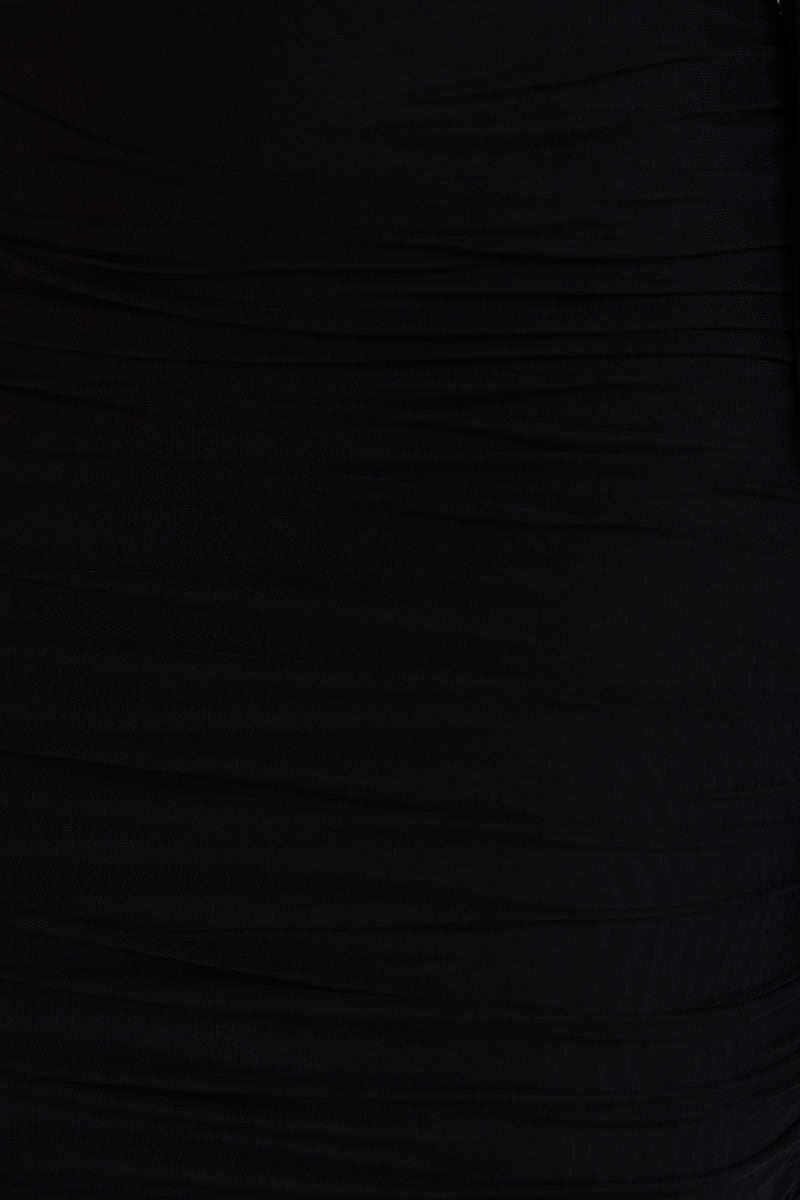 Close-up of Malakai Midi Dress showcasing the black mesh overlay and ruching details on the fabric.