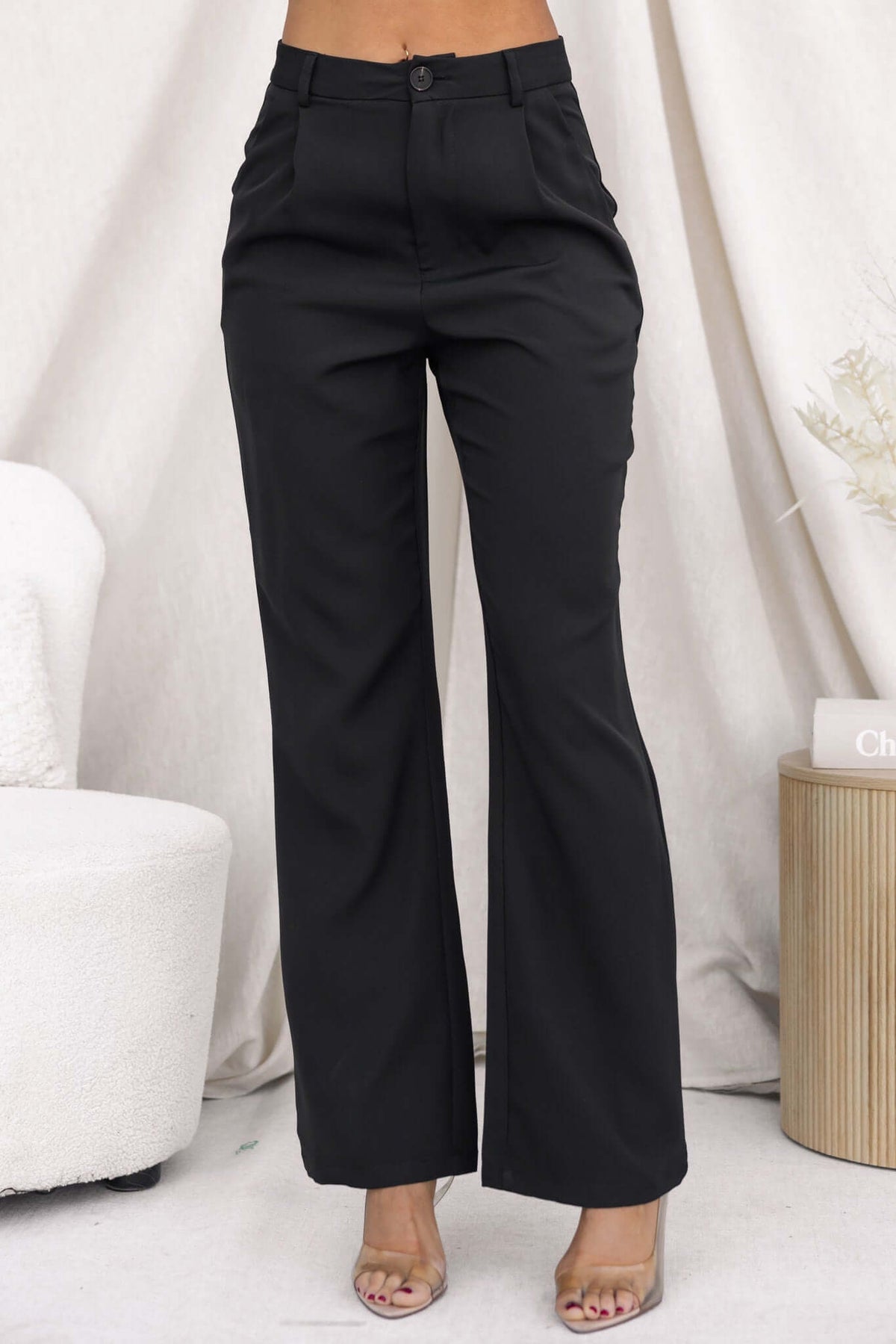 Ulani Pants in black, mid-high waist fit with pockets, non-lined and non-stretch, perfect for casual or formal wear.