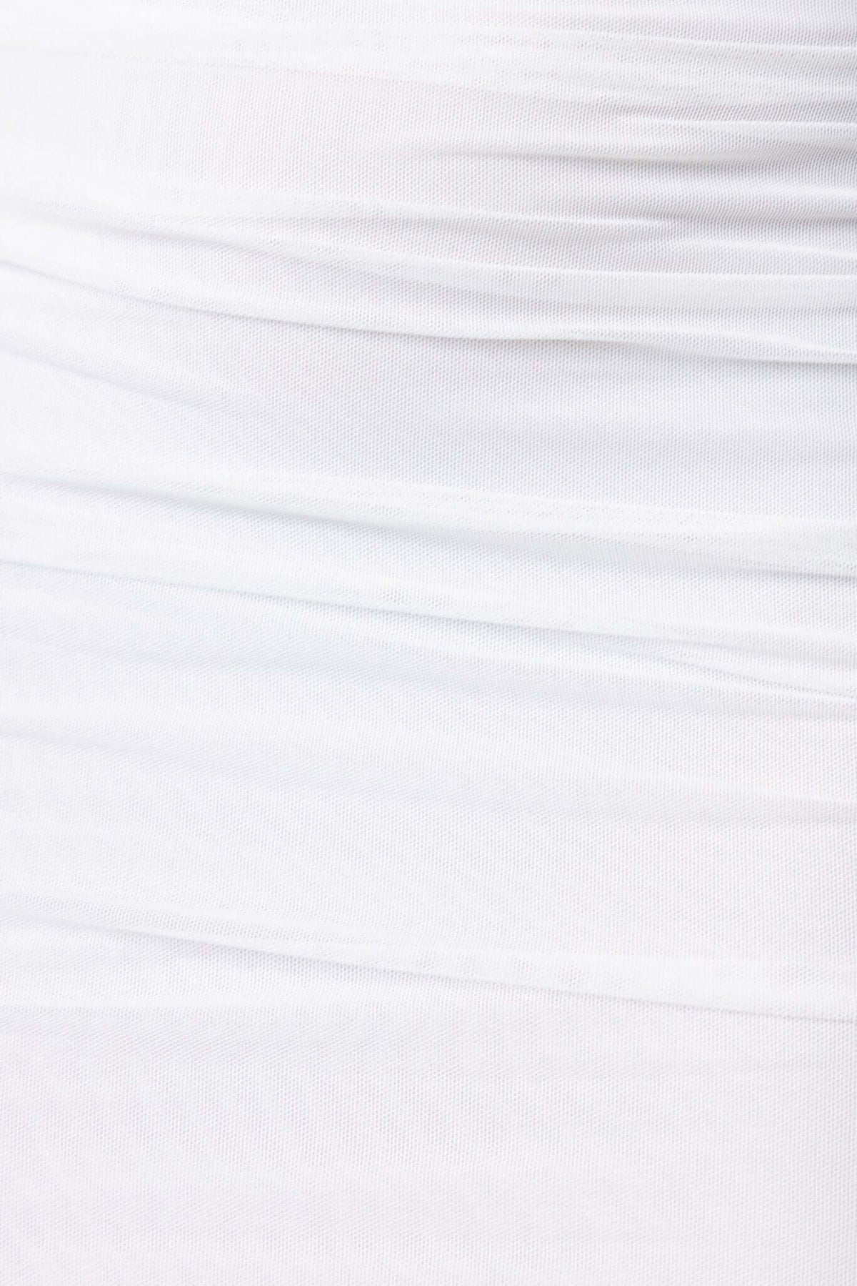 Ruching detail of the Stolen Kiss Maxi Dress with a soft mesh overlay in pure white fabric.